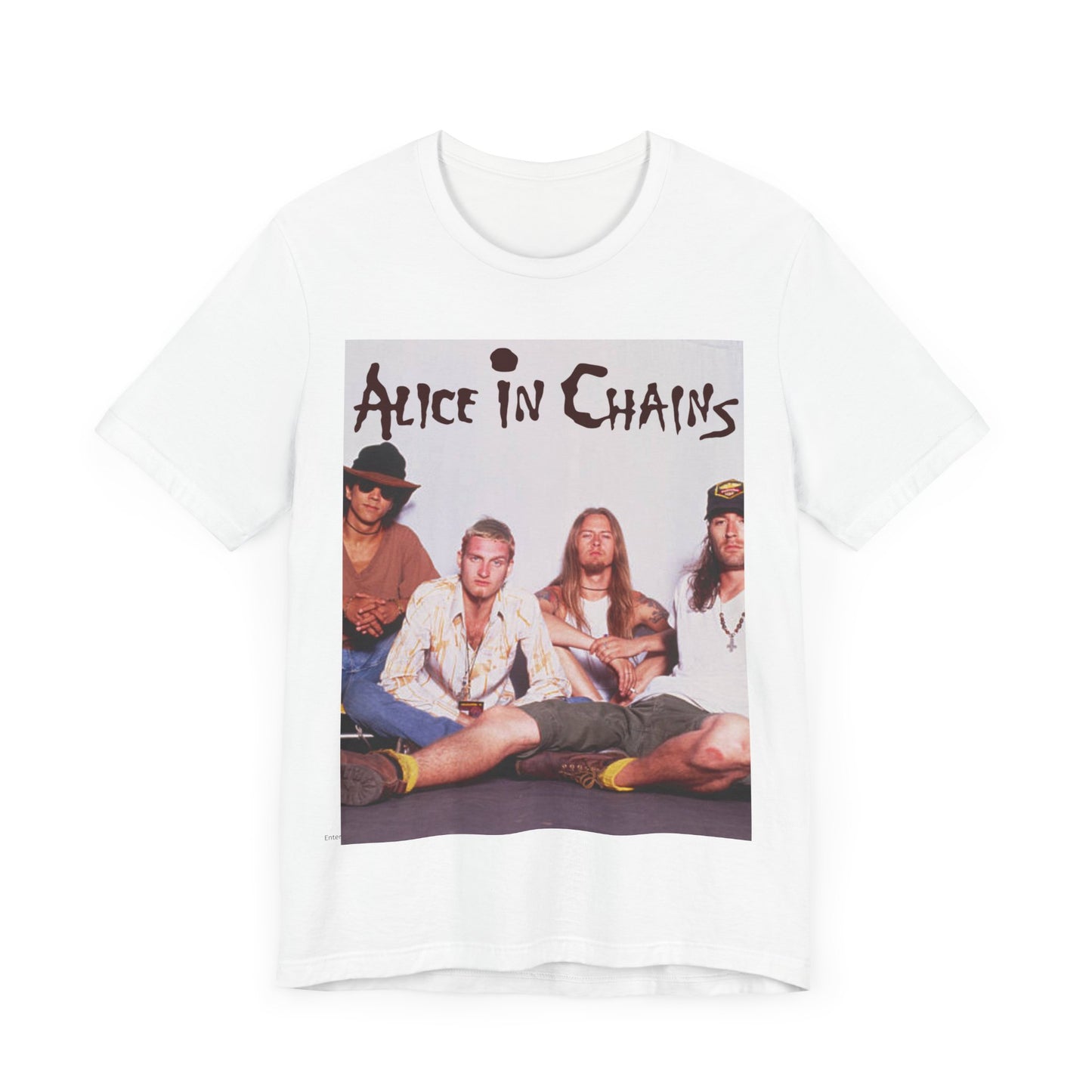 A black graphic t-shirt featuring a classic rock graphic of Alice In Chains from the 1990s, possibly with band members or stylized logo.