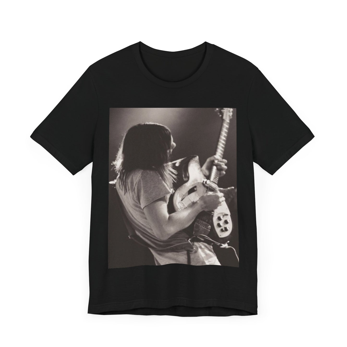 A black graphic t-shirt featuring a black and white graphic or photo of Tame Impala performing live on stage.