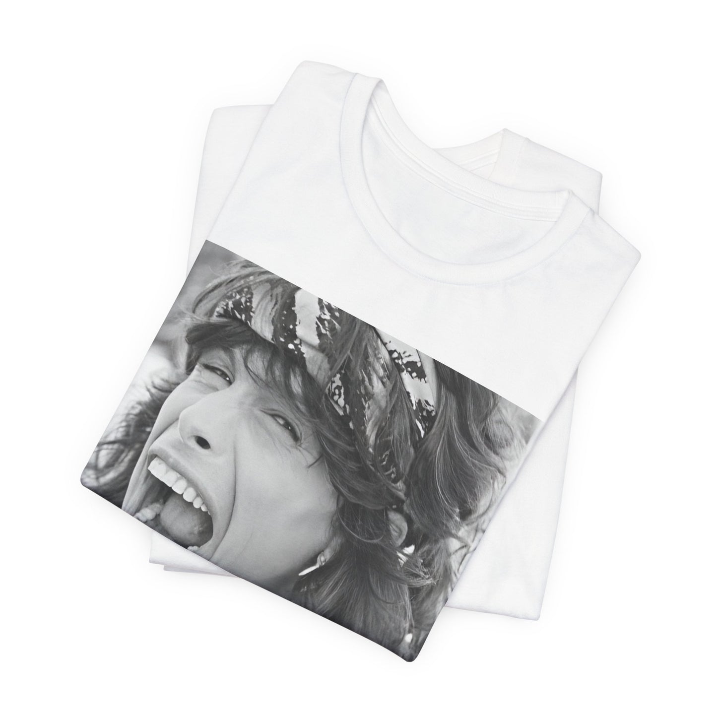 A black graphic t-shirt featuring a candid, dynamic photo of Aerosmith band members on tour in the 1970s, possibly showing action or interaction on stage or backstage.