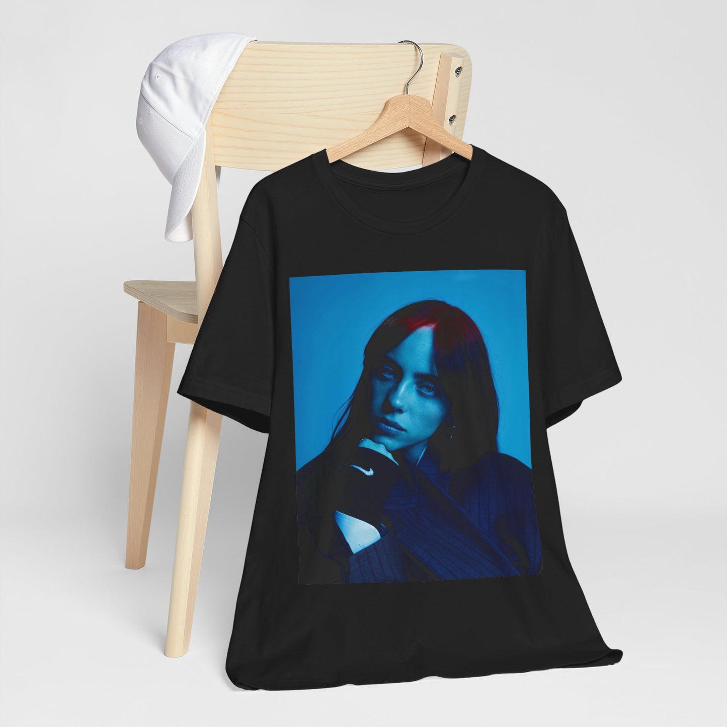 A soft, slightly blurred photo of Billie Eilish, evoking the dreamy and nostalgic feel of her song 'Ocean Eyes,' printed on a t-shirt.