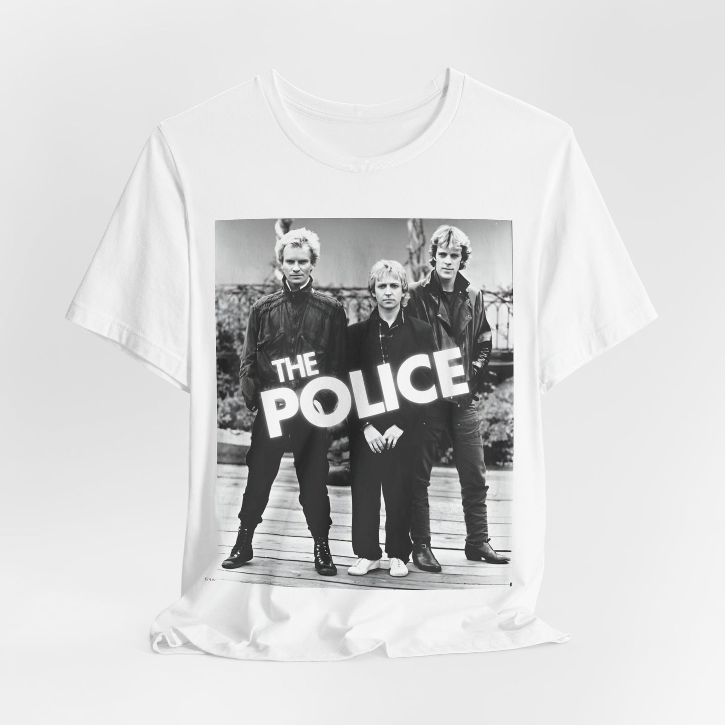 A black graphic t-shirt featuring an 80s pop rock aesthetic black and white graphic of The Police.