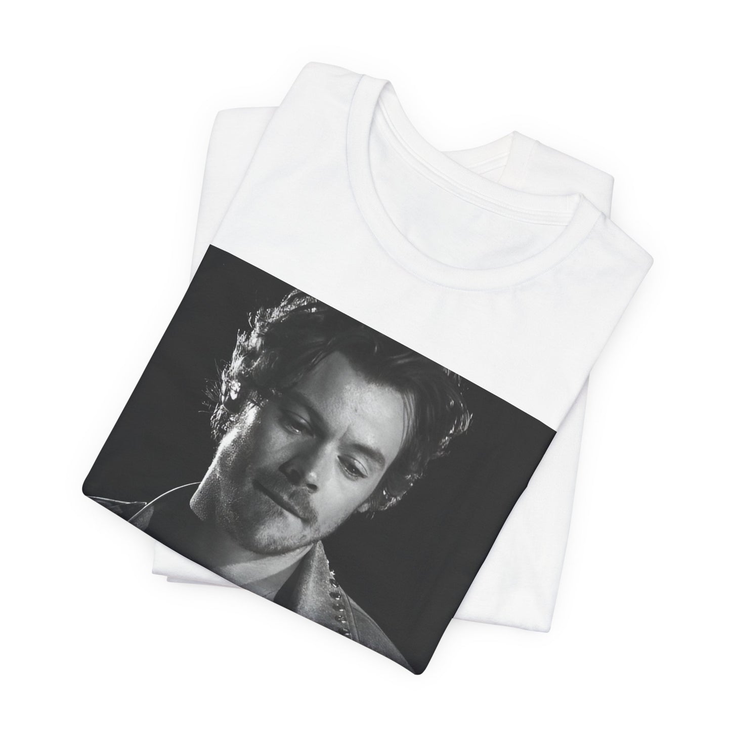 A black graphic t-shirt featuring a black and white graphic inspired by Harry Styles' tattoos.