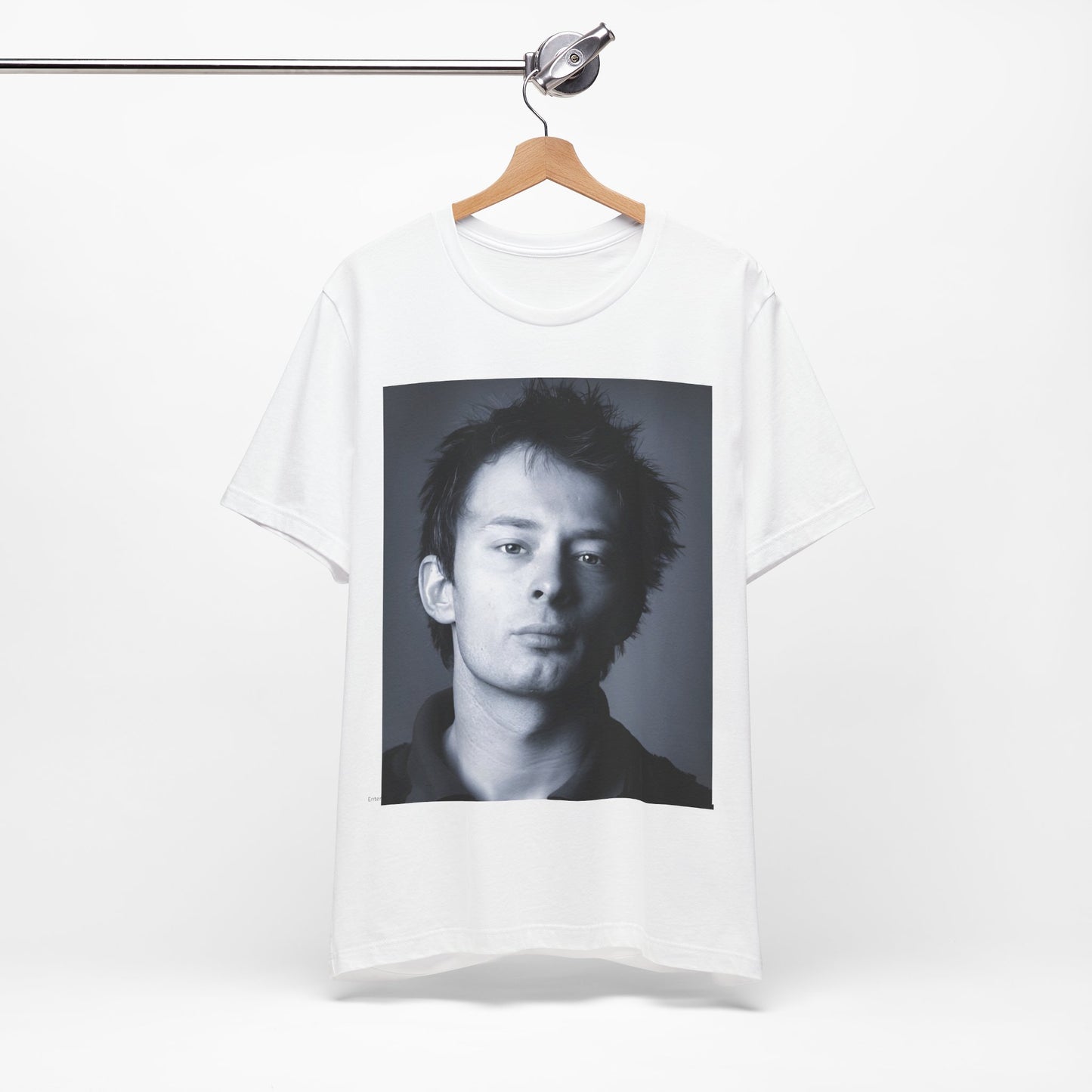 A black graphic t-shirt featuring an enigmatic graphic of Thom Yorke from Radiohead as a frontman.