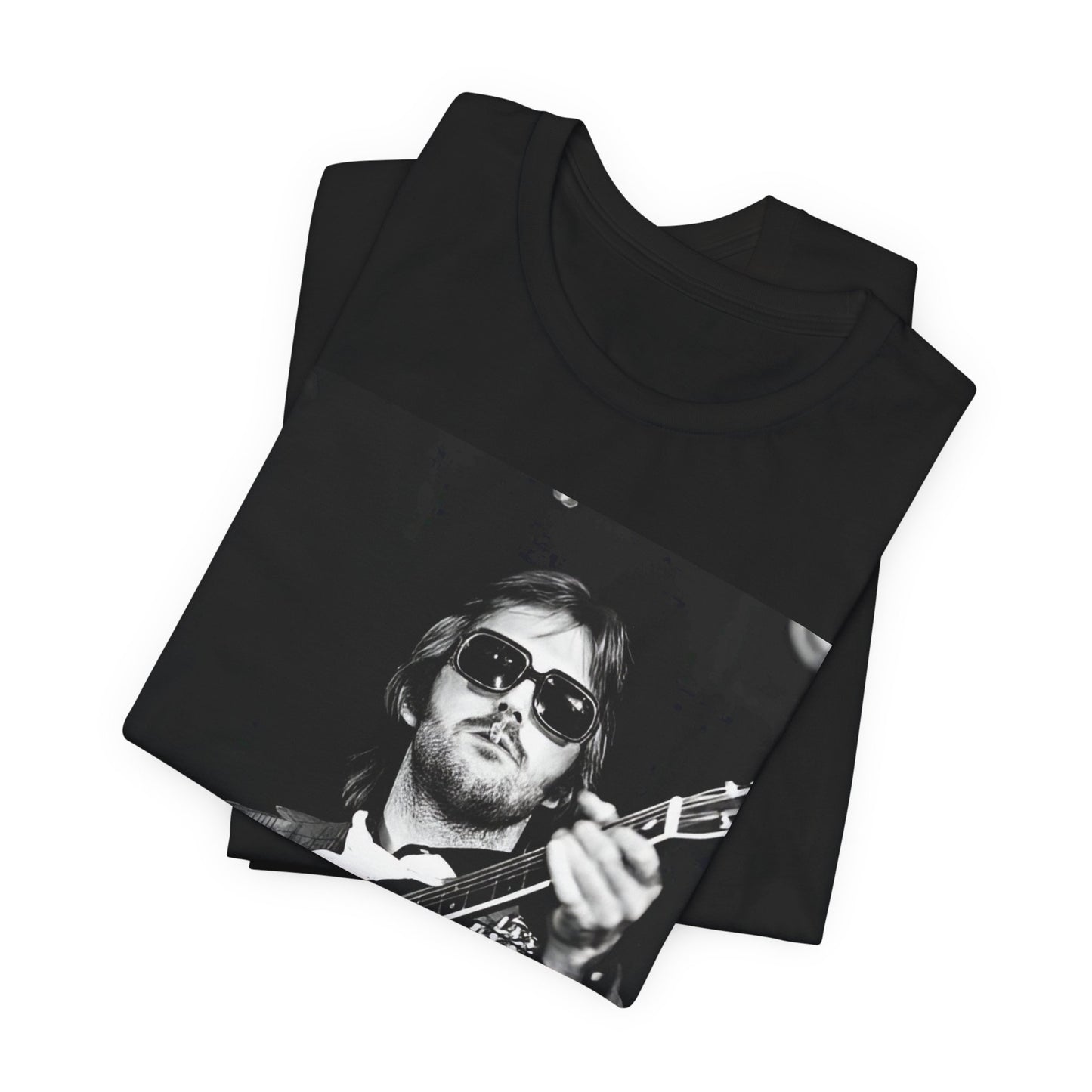 A black graphic t-shirt featuring a graphic of Eric Clapton with a chill blues rock vibe.