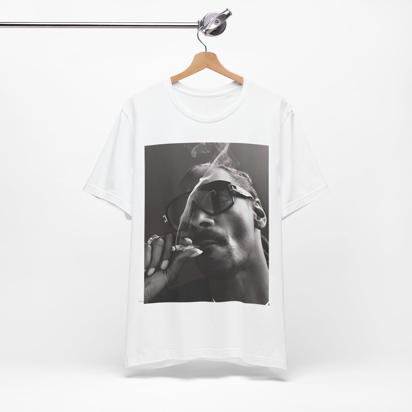 A black graphic t-shirt featuring an iconic black and white shaded portrait graphic of Snoop Dogg.