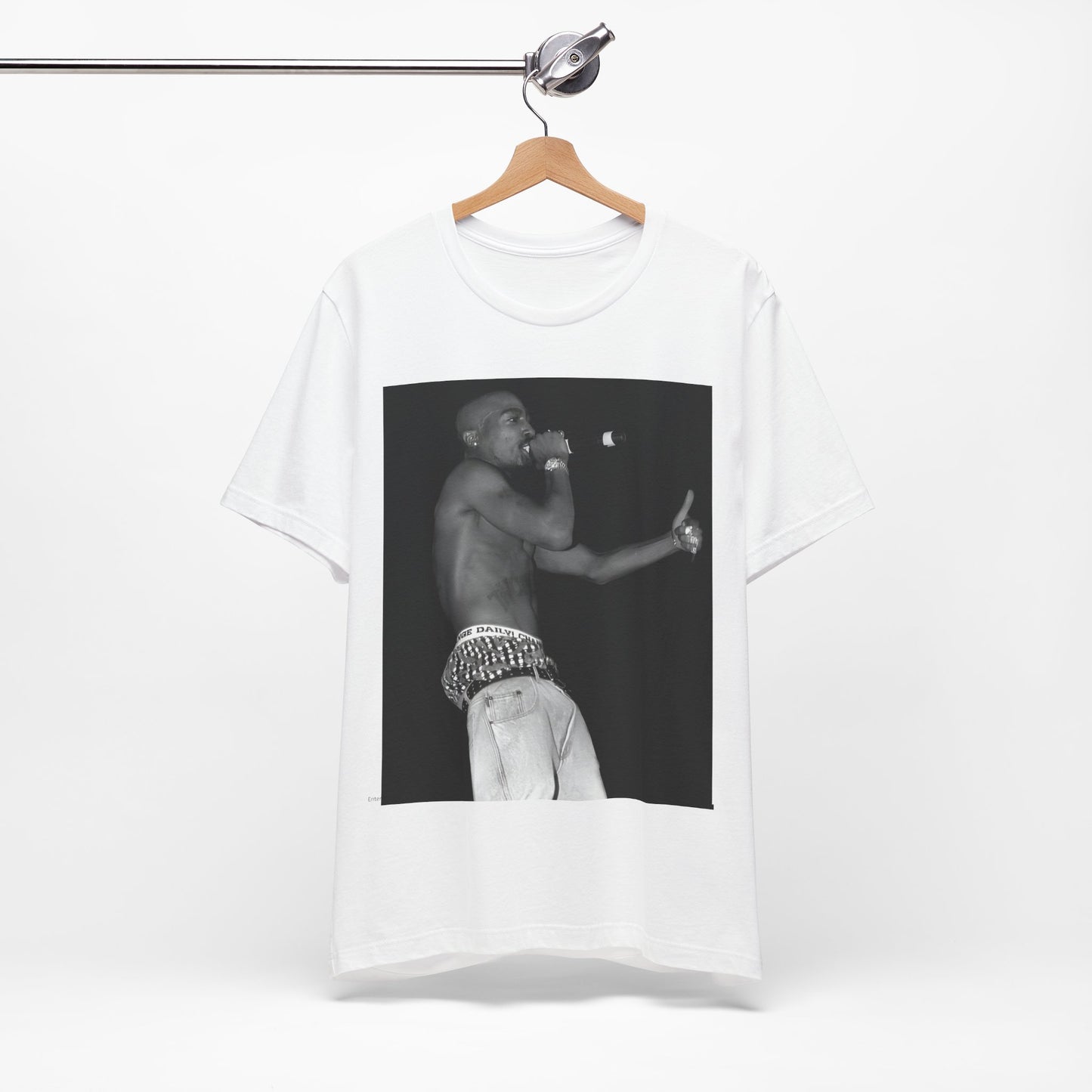 A black graphic t-shirt featuring a graphic of Tupac as a justice fighter.
