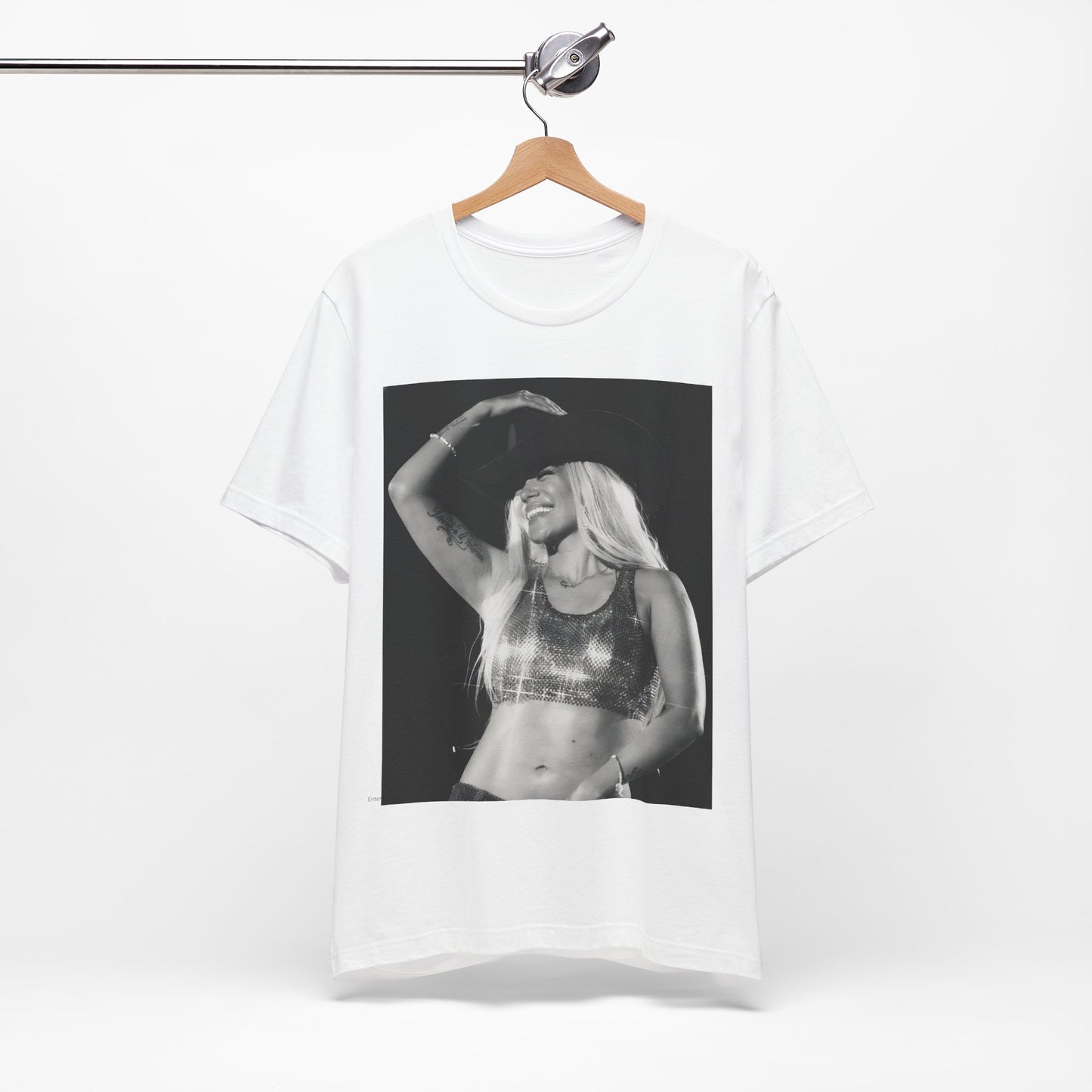 A black graphic t-shirt featuring a black and white graphic or photo of Karol G performing live on stage.