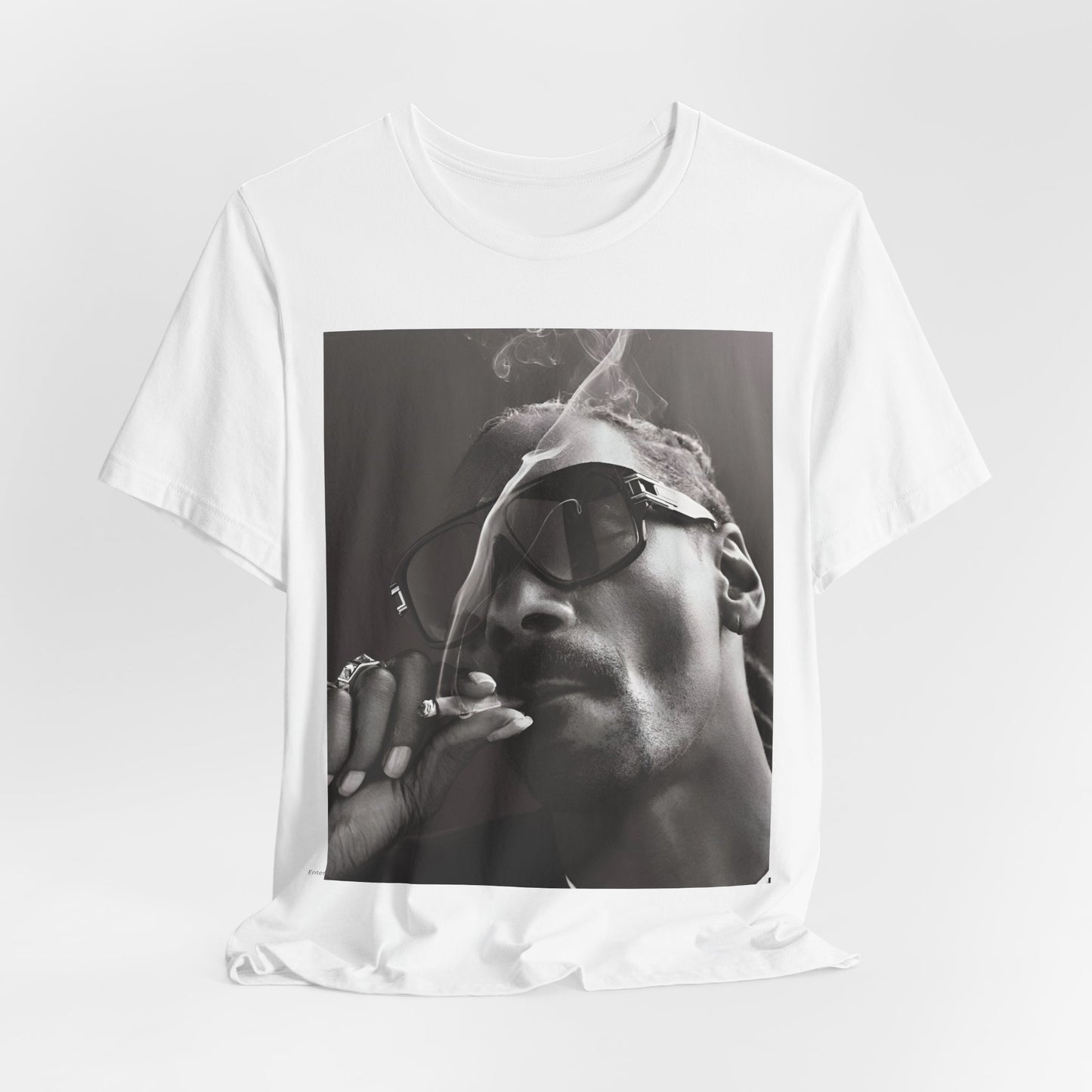 A black graphic t-shirt featuring an iconic black and white shaded portrait graphic of Snoop Dogg.