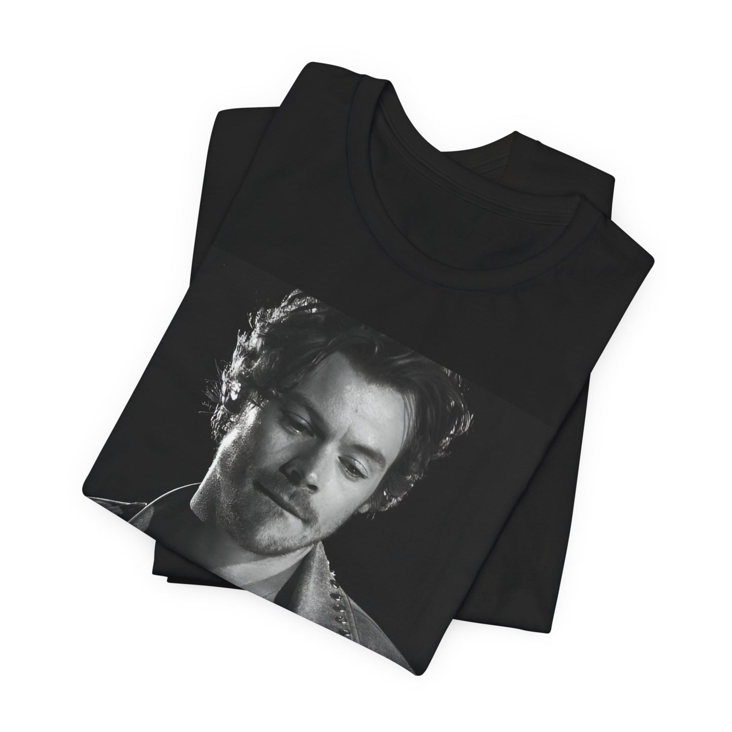 A black graphic t-shirt featuring a black and white graphic inspired by Harry Styles' tattoos.