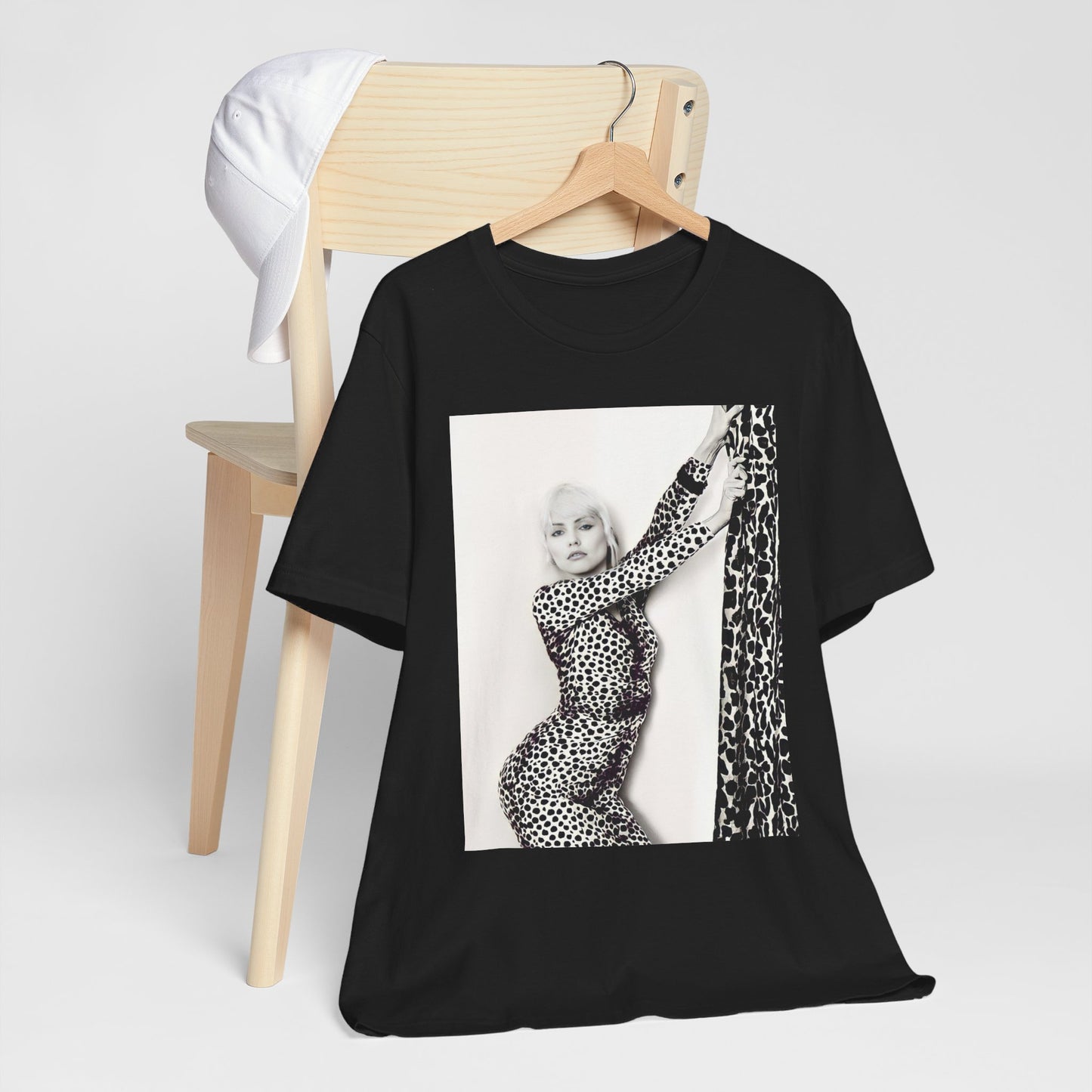 A black graphic t-shirt featuring a black and white, wild-style graphic of Blondie, emphasizing their untamed spirit.