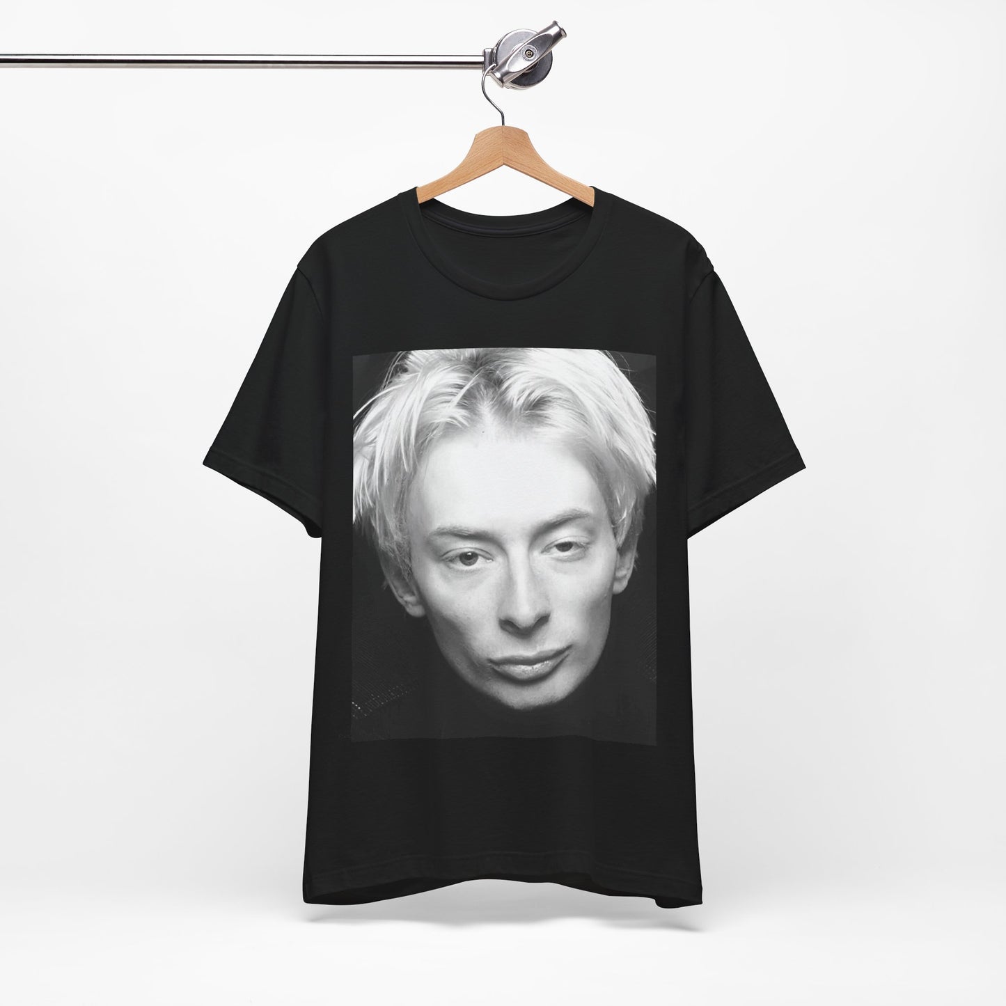 A black graphic t-shirt featuring a 90s black and white portrait photo of Thom Yorke from Radiohead.