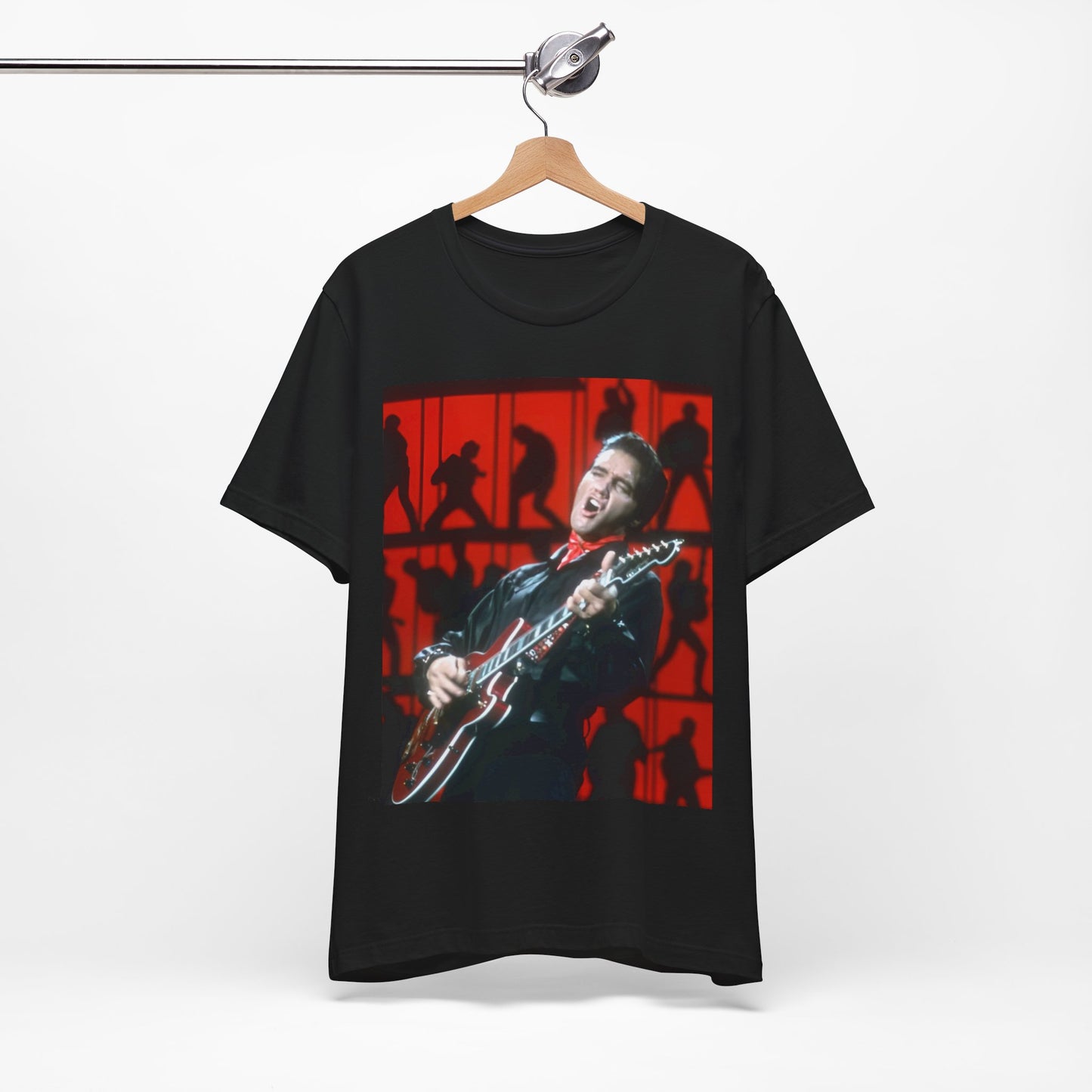 A black graphic t-shirt featuring a vintage photo of Elvis Presley from his Las Vegas residency.