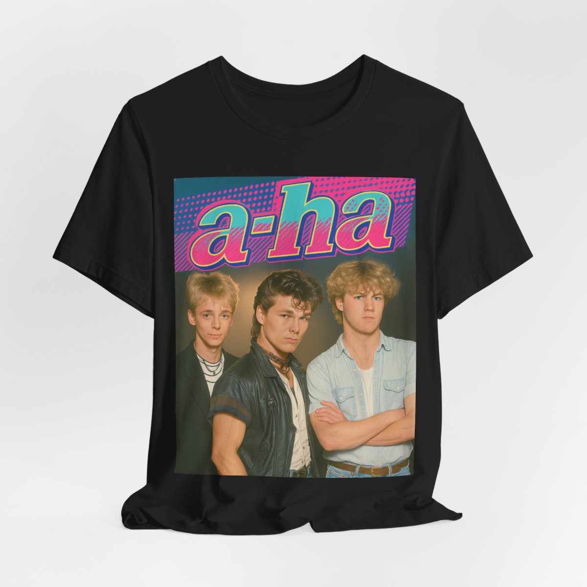 A black graphic t-shirt featuring a retro 80s-style band graphic for A-HA, possibly with band members in a stylized design.