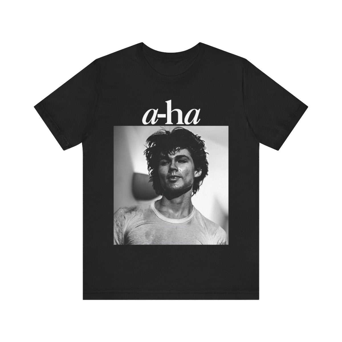 A black graphic t-shirt featuring the A-HA logo integrated with a black and white photo of the band members.