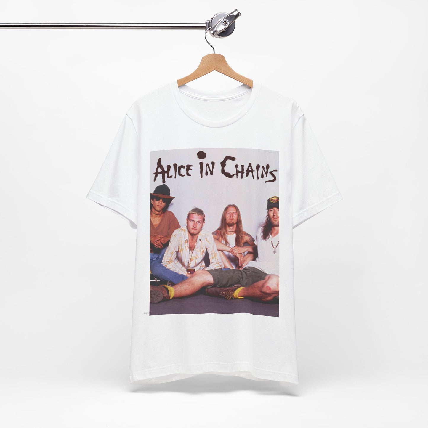 A black graphic t-shirt featuring a classic rock graphic of Alice In Chains from the 1990s, possibly with band members or stylized logo.