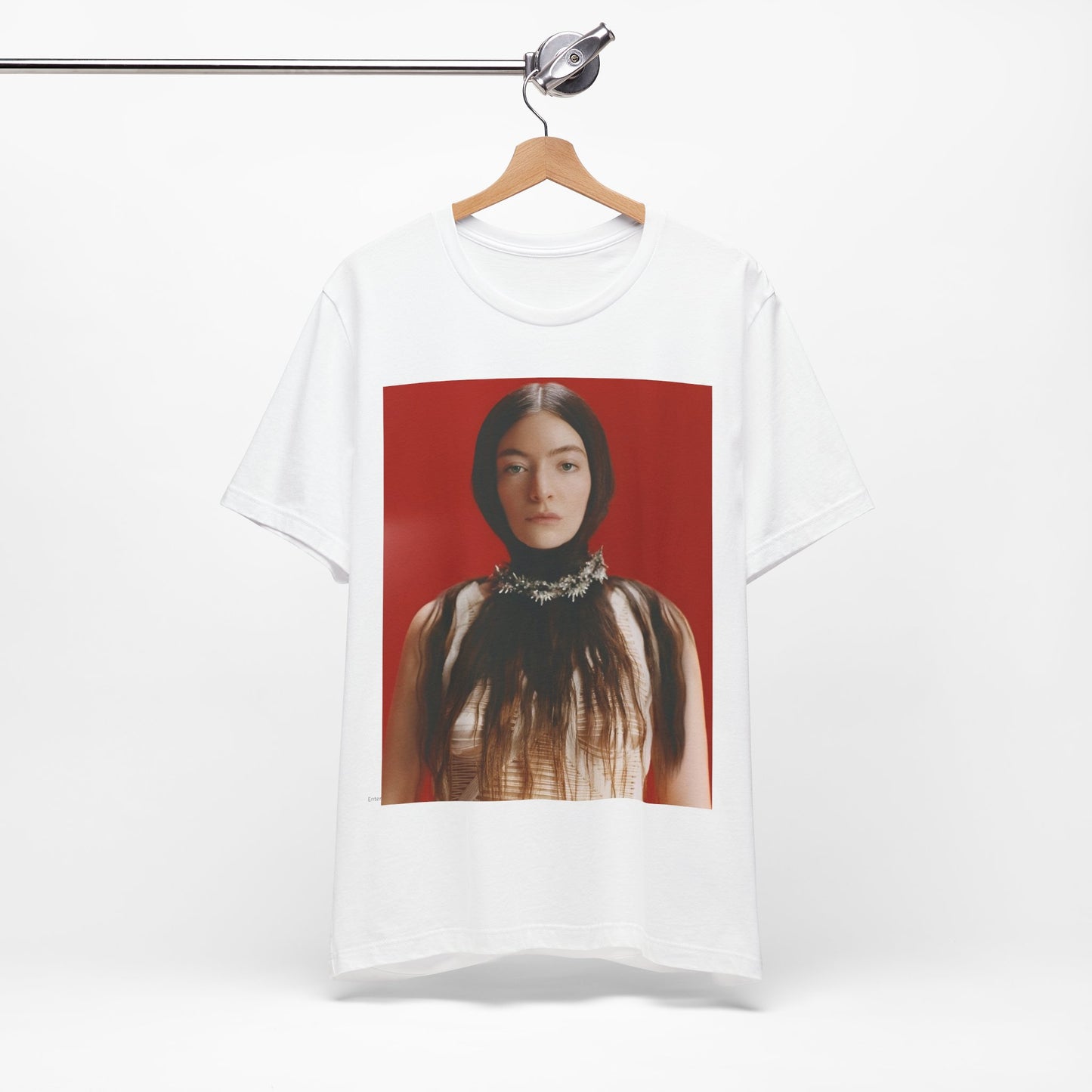 A black graphic t-shirt featuring a vintage indie pop icon graphic of Lorde.