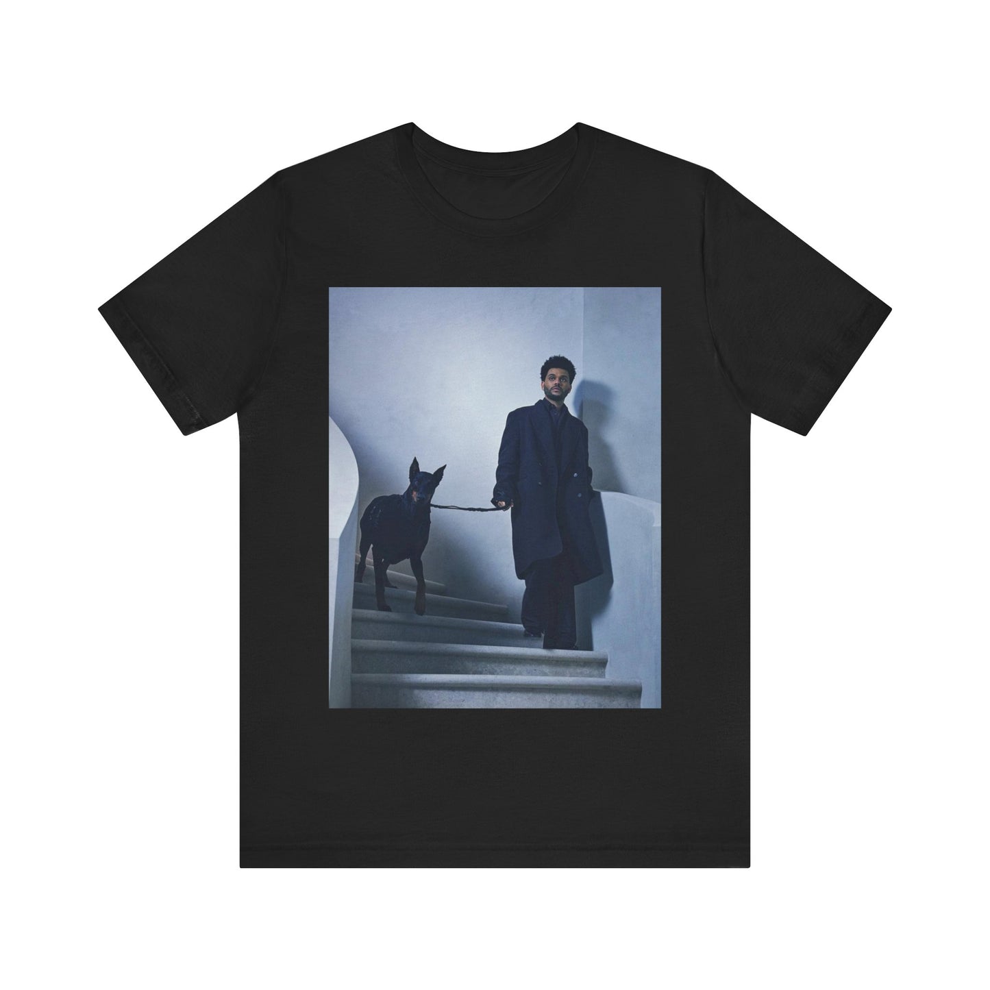 A black graphic t-shirt featuring a photo of The Weeknd with a doberman.