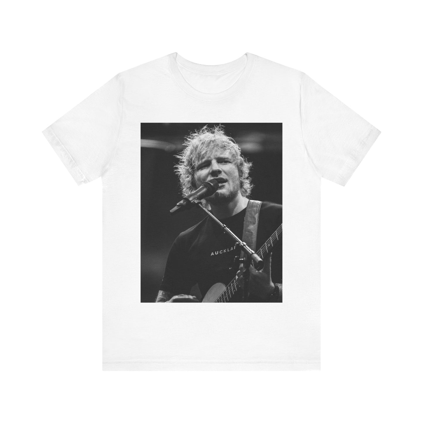 A black graphic t-shirt featuring a black and white photo of Ed Sheeran performing live.