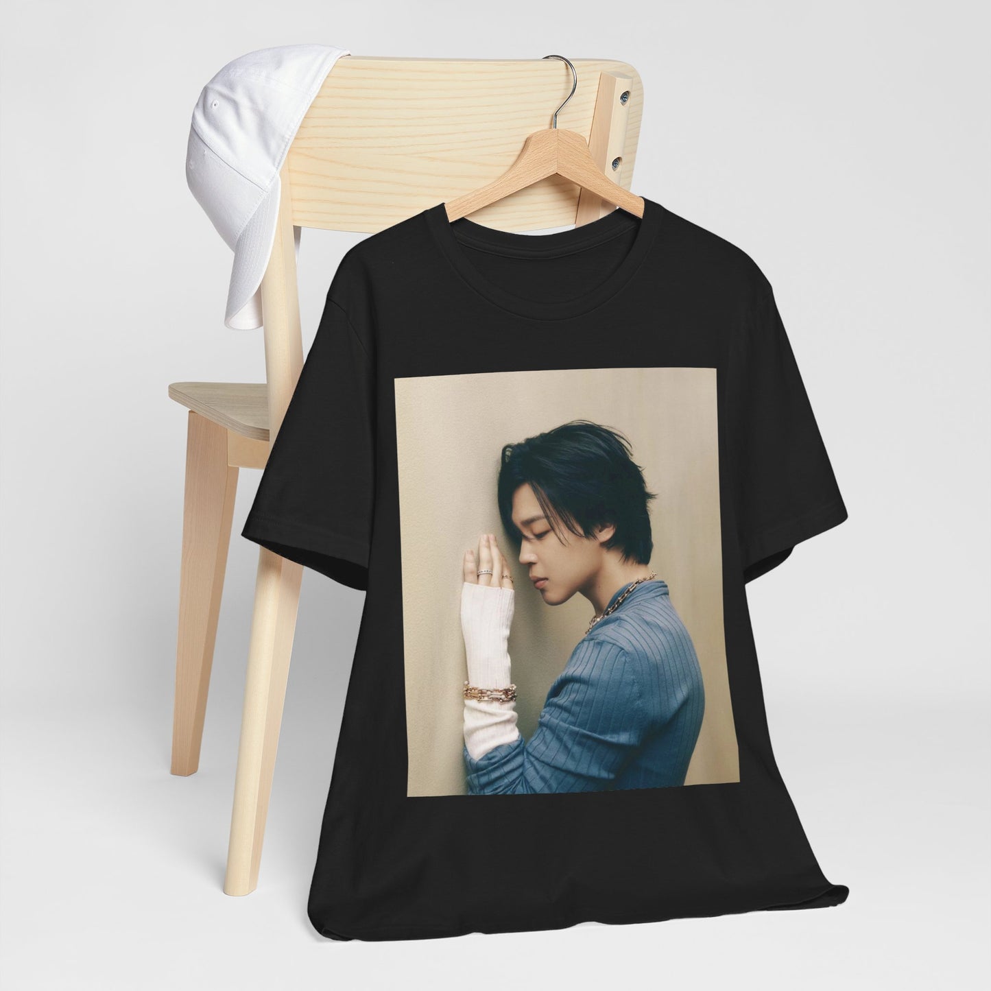 A black graphic t-shirt featuring a cool K-Pop idol essential graphic of Jimin.