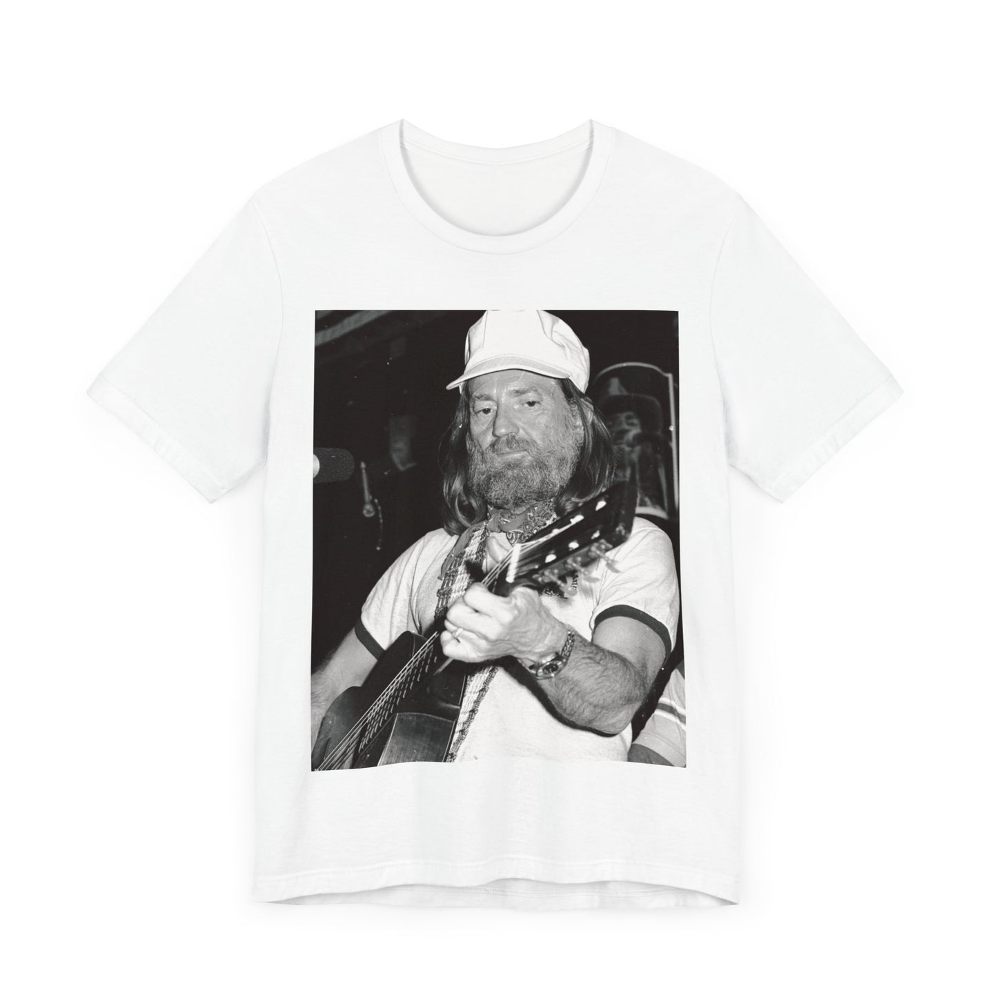 A black graphic t-shirt featuring a 70s cool free spirit graphic of Willie Nelson.
