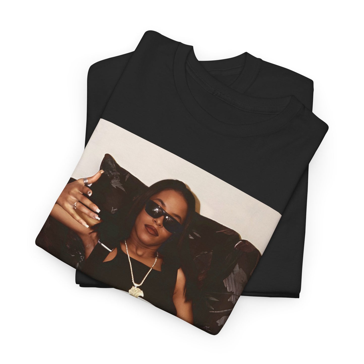 A black graphic t-shirt featuring a bold R&B superstar graphic of Aaliyah.