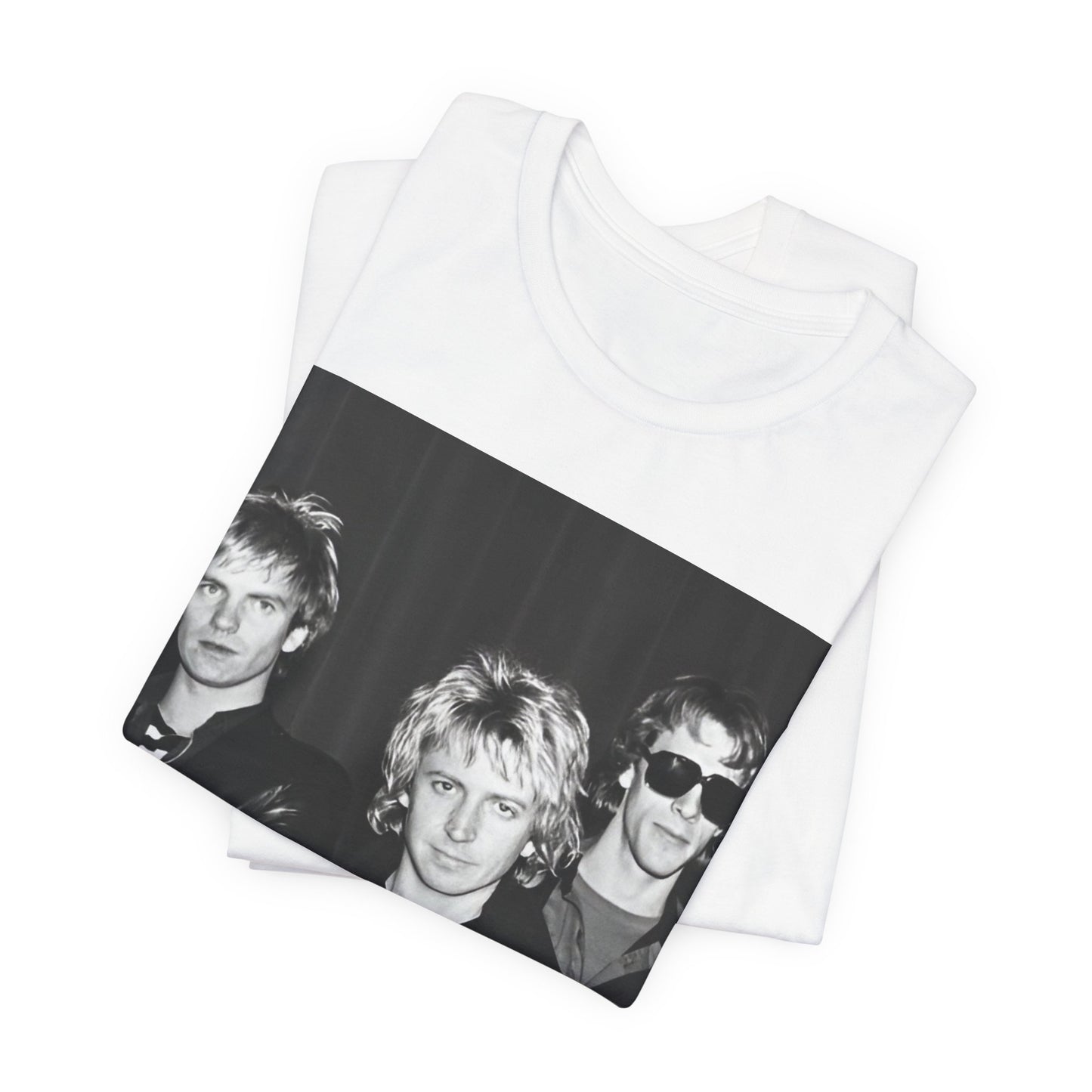 A black graphic t-shirt featuring a black and white, monochrome graphic or photo of The Police.
