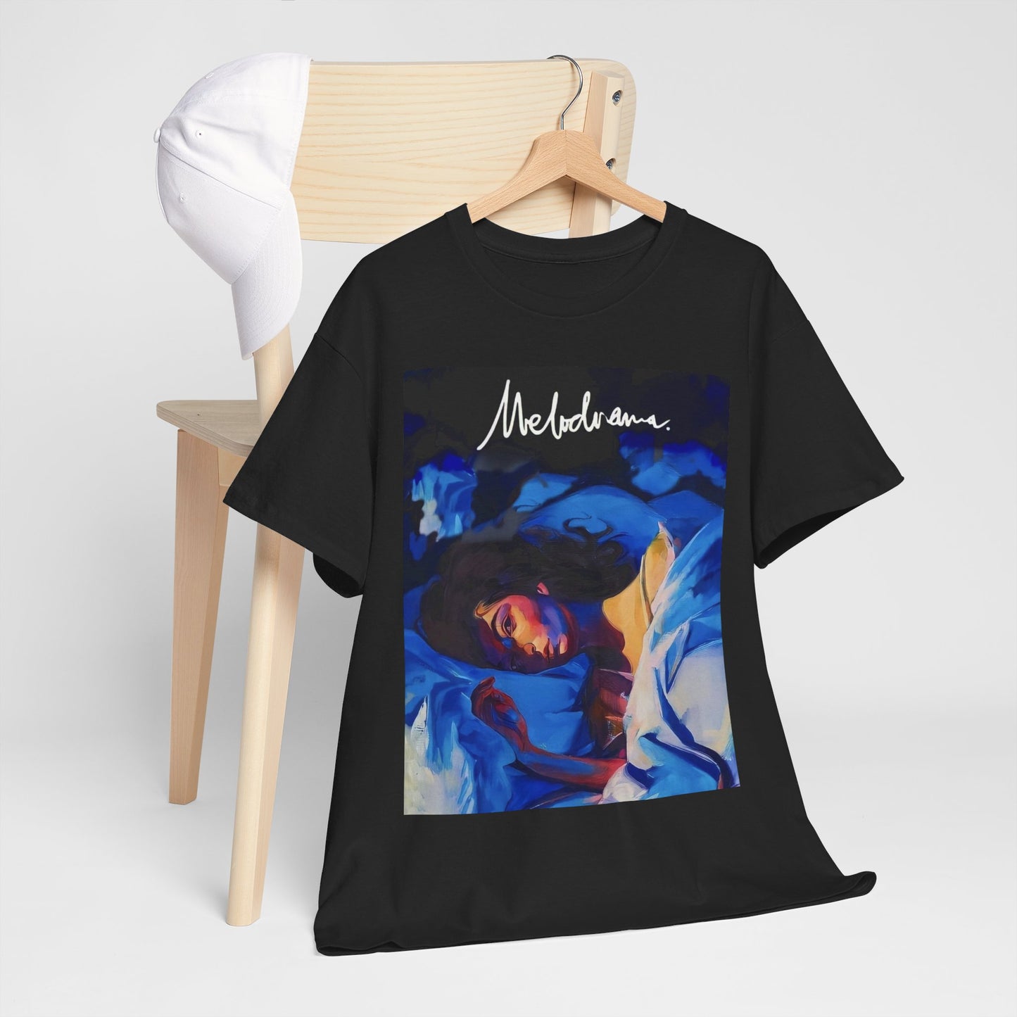 A black graphic t-shirt featuring a graphic related to Lorde's 'Melodrama' album.