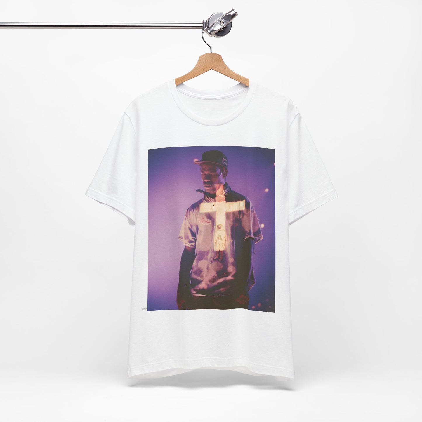 A black graphic t-shirt featuring a graphic of Travis Scott with dark fantasy vibes.