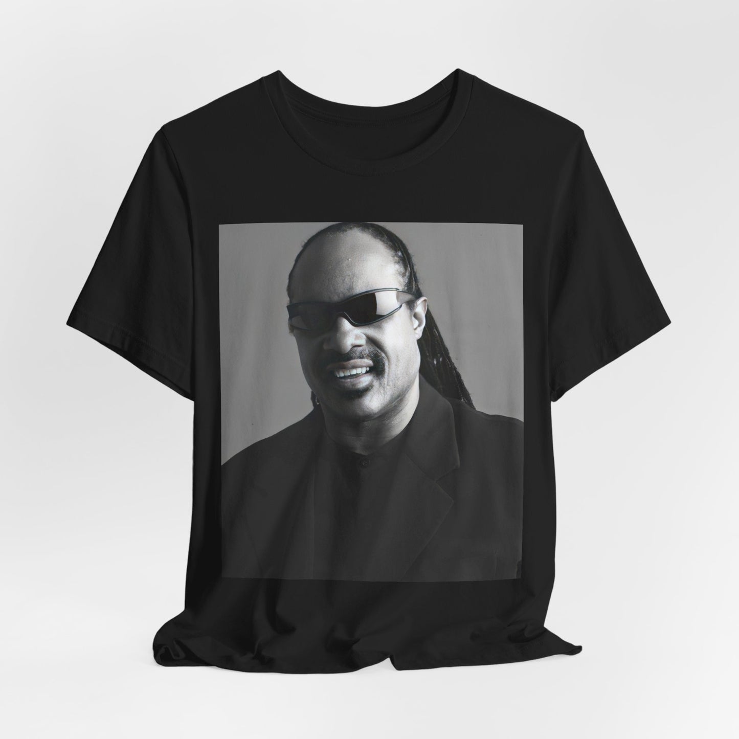 A black graphic t-shirt featuring a classic Motown legend black and white graphic of Stevie Wonder.