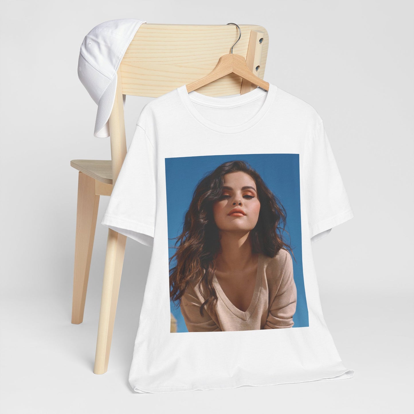 A black graphic t-shirt featuring a vintage pop icon graphic of Selena Gomez.