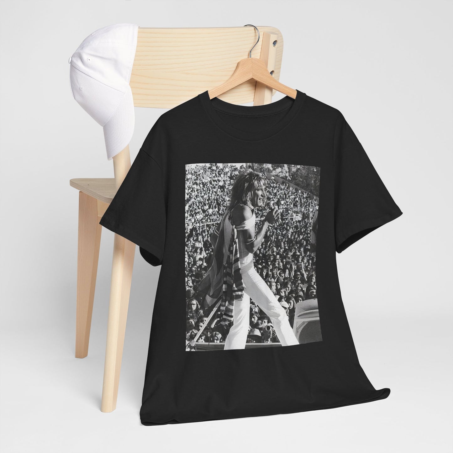 A black graphic t-shirt featuring a 70s on stage concert graphic of Rod Stewart.