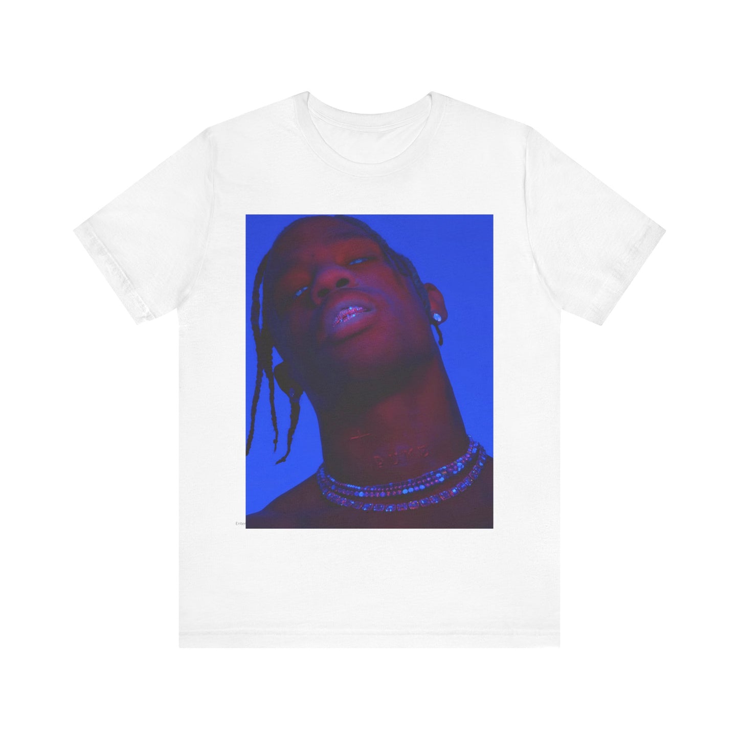 A black graphic t-shirt featuring a bold graphic of Travis Scott as a rap superstar.