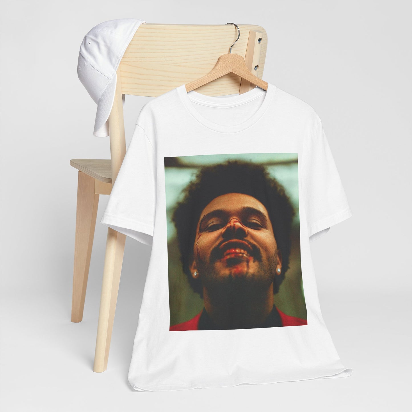 A black graphic t-shirt featuring the album cover art for The Weeknd's 'After Hours'.