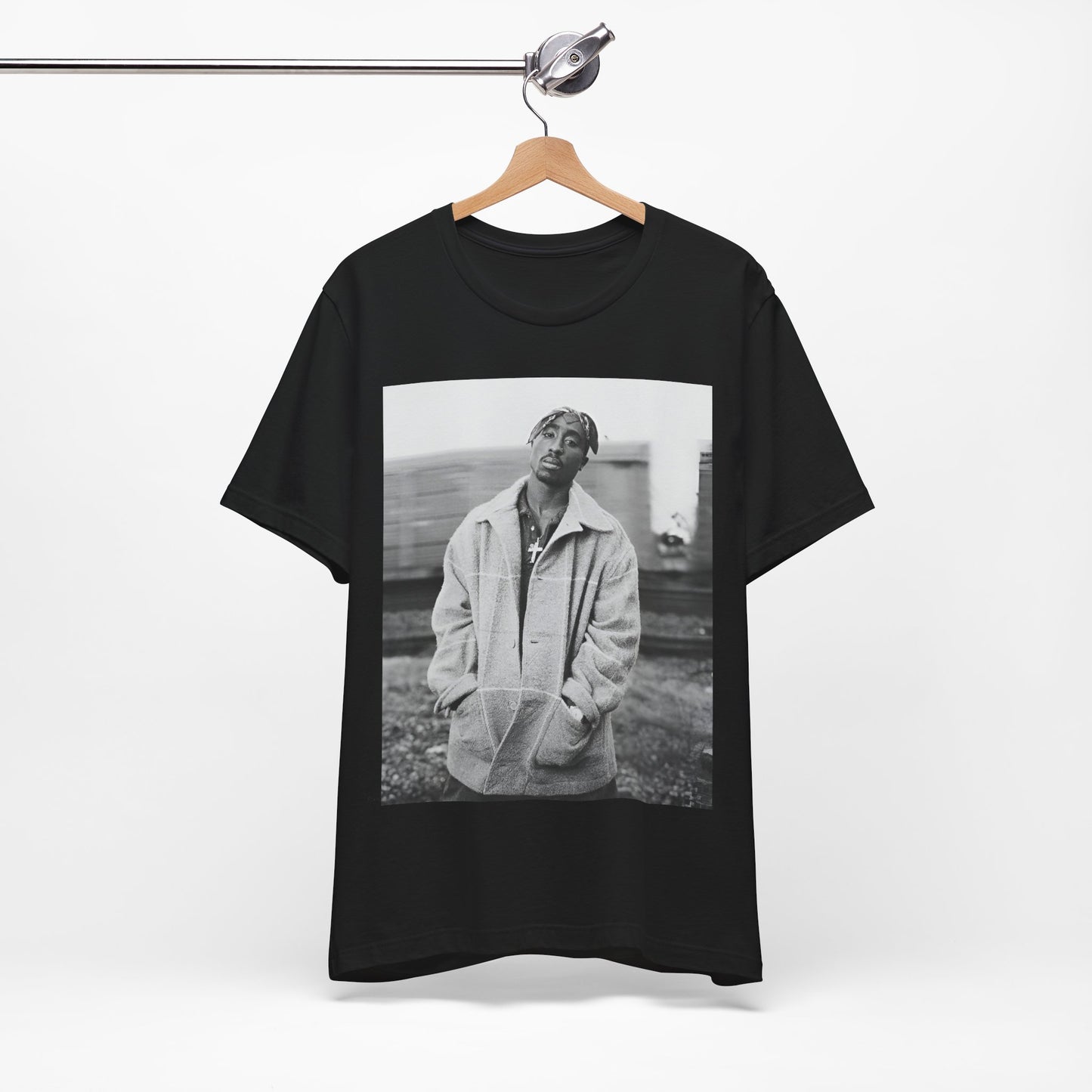 A black graphic t-shirt featuring a graphic related to Tupac's 'Thug Life' philosophy.