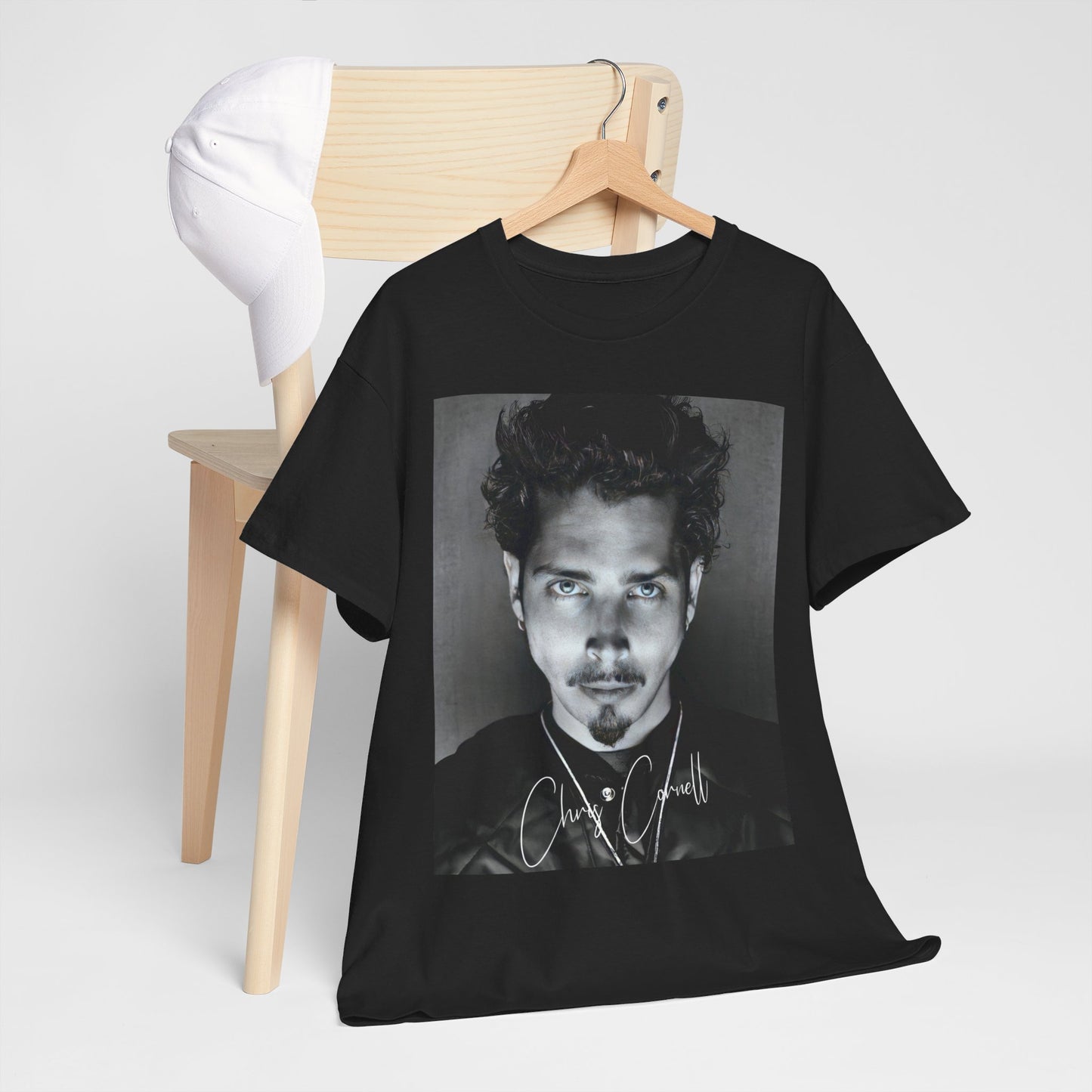 A black graphic t-shirt featuring a retro graphic inspired by Soundgarden's 'Black Hole Sun' and Chris Cornell.
