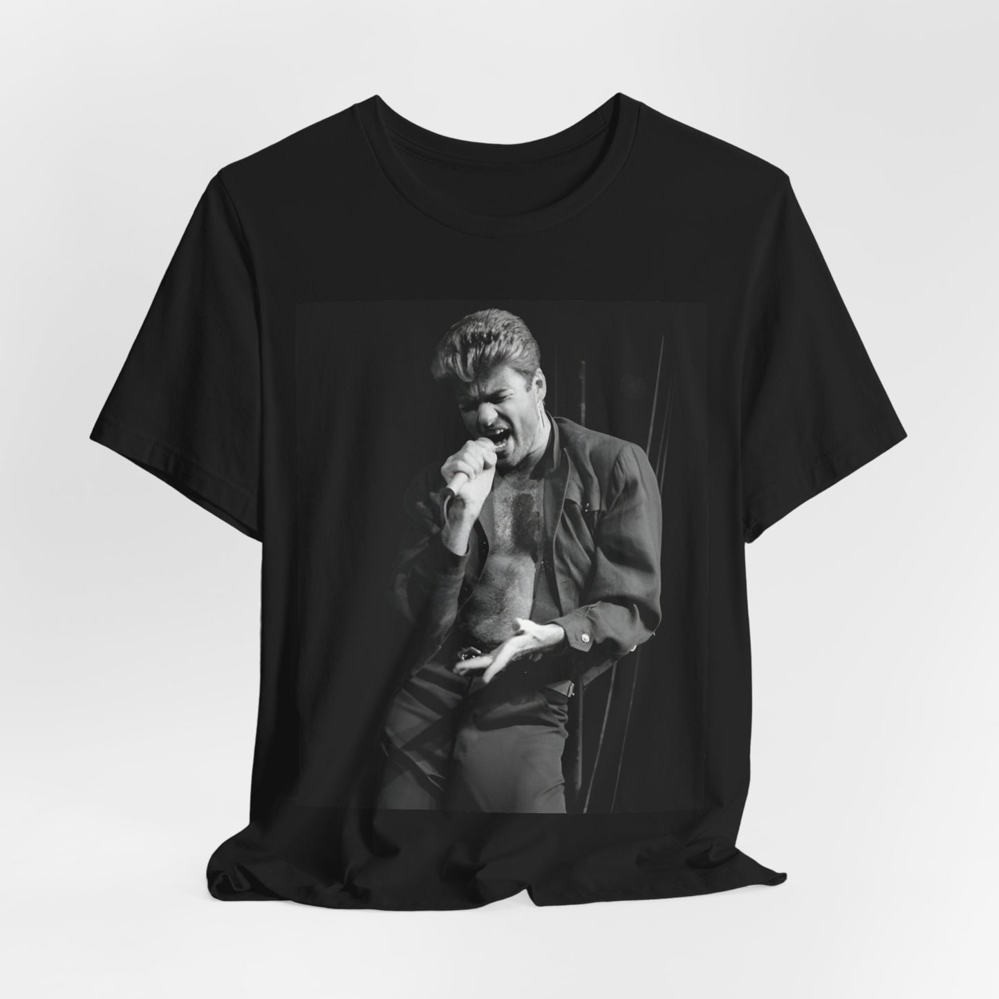 A black graphic t-shirt featuring a glamorous photo or graphic of George Michael performing live.