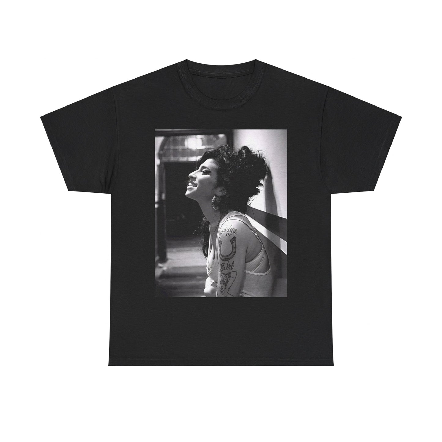 A black graphic t-shirt featuring a candid backstage photo of Amy Winehouse from her 'Back to Black' era, showing her in a relaxed setting.