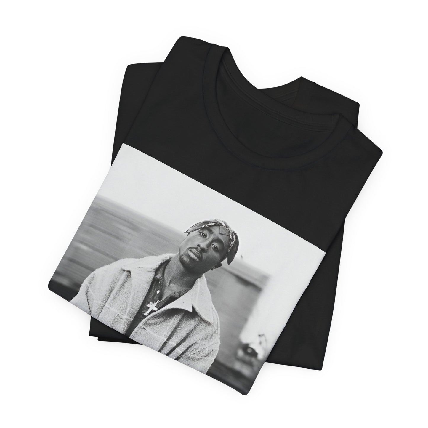 A black graphic t-shirt featuring a graphic related to Tupac's 'Thug Life' philosophy.
