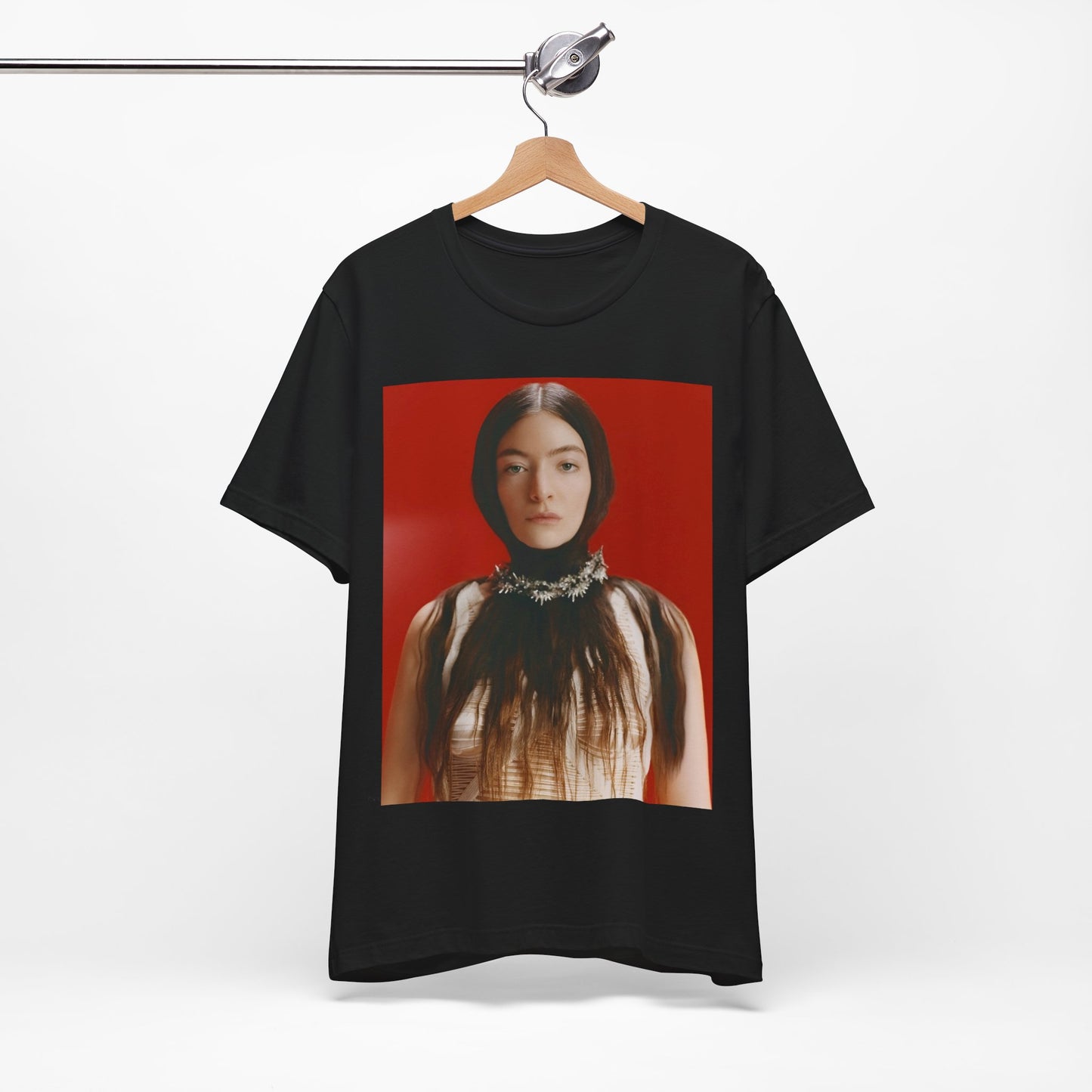 A black graphic t-shirt featuring a vintage indie pop icon graphic of Lorde.