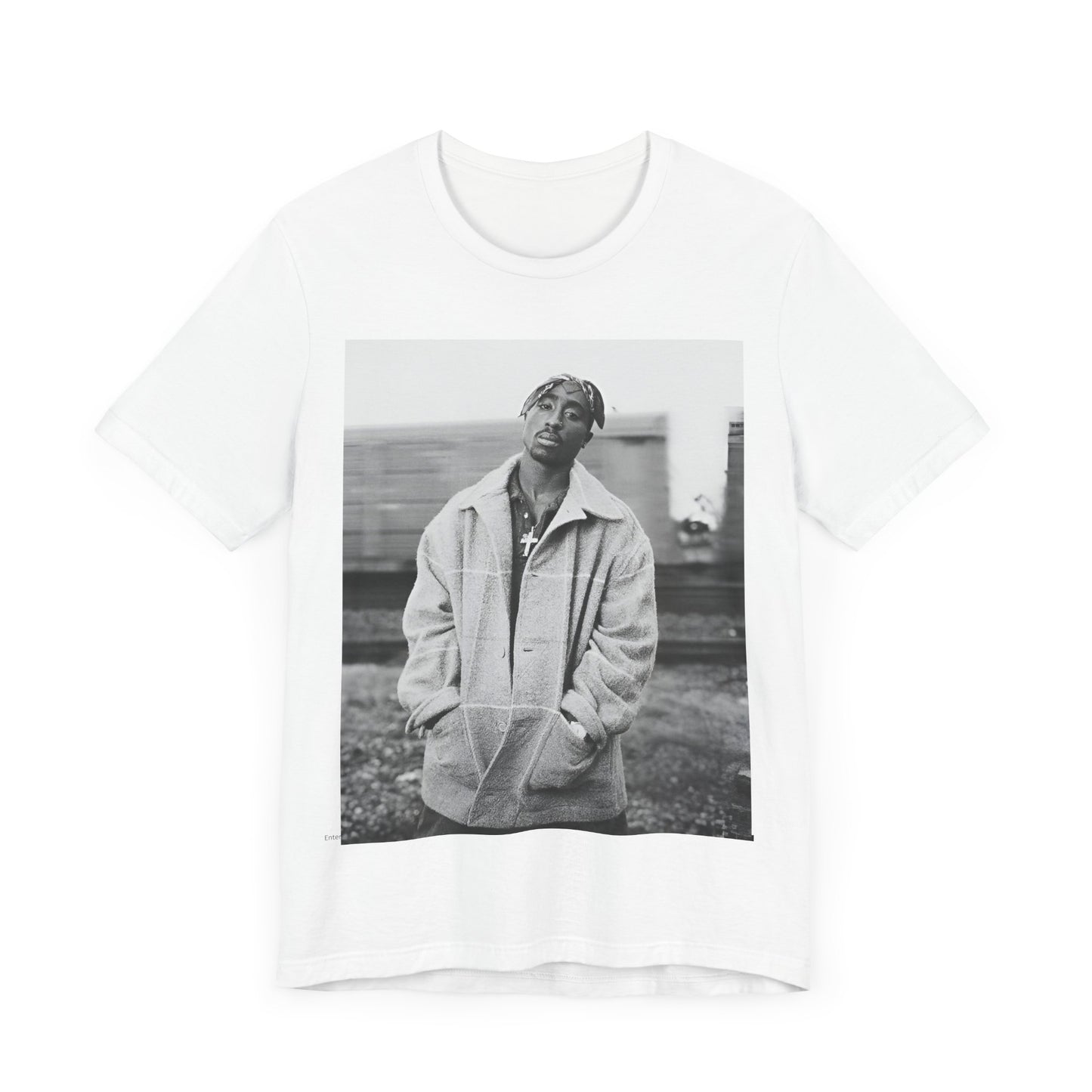 A black graphic t-shirt featuring a graphic related to Tupac's 'Thug Life' philosophy.