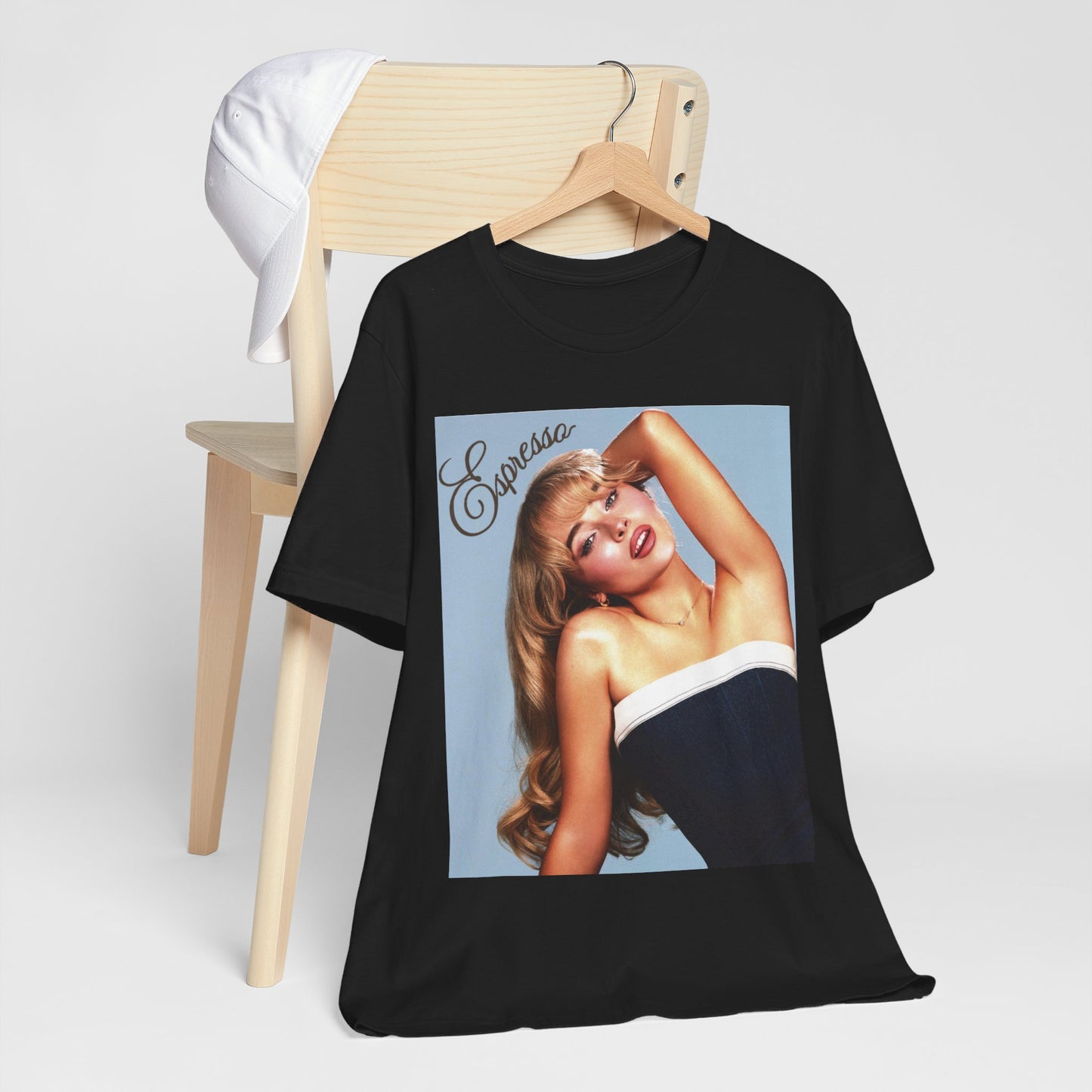 A black graphic t-shirt featuring a graphic related to Sabrina Carpenter's 'Espresso' song.