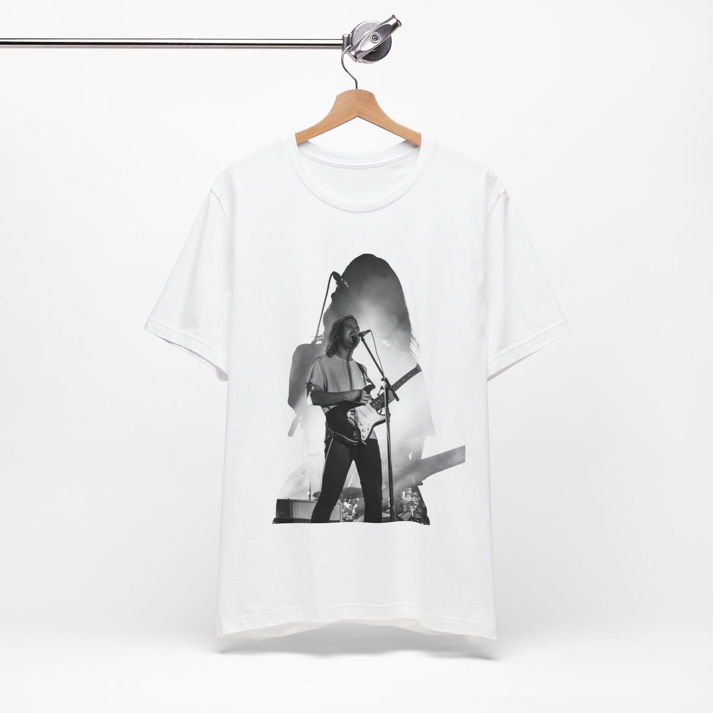 A black graphic t-shirt featuring a black and white, monochrome graphic or photo of Tame Impala.