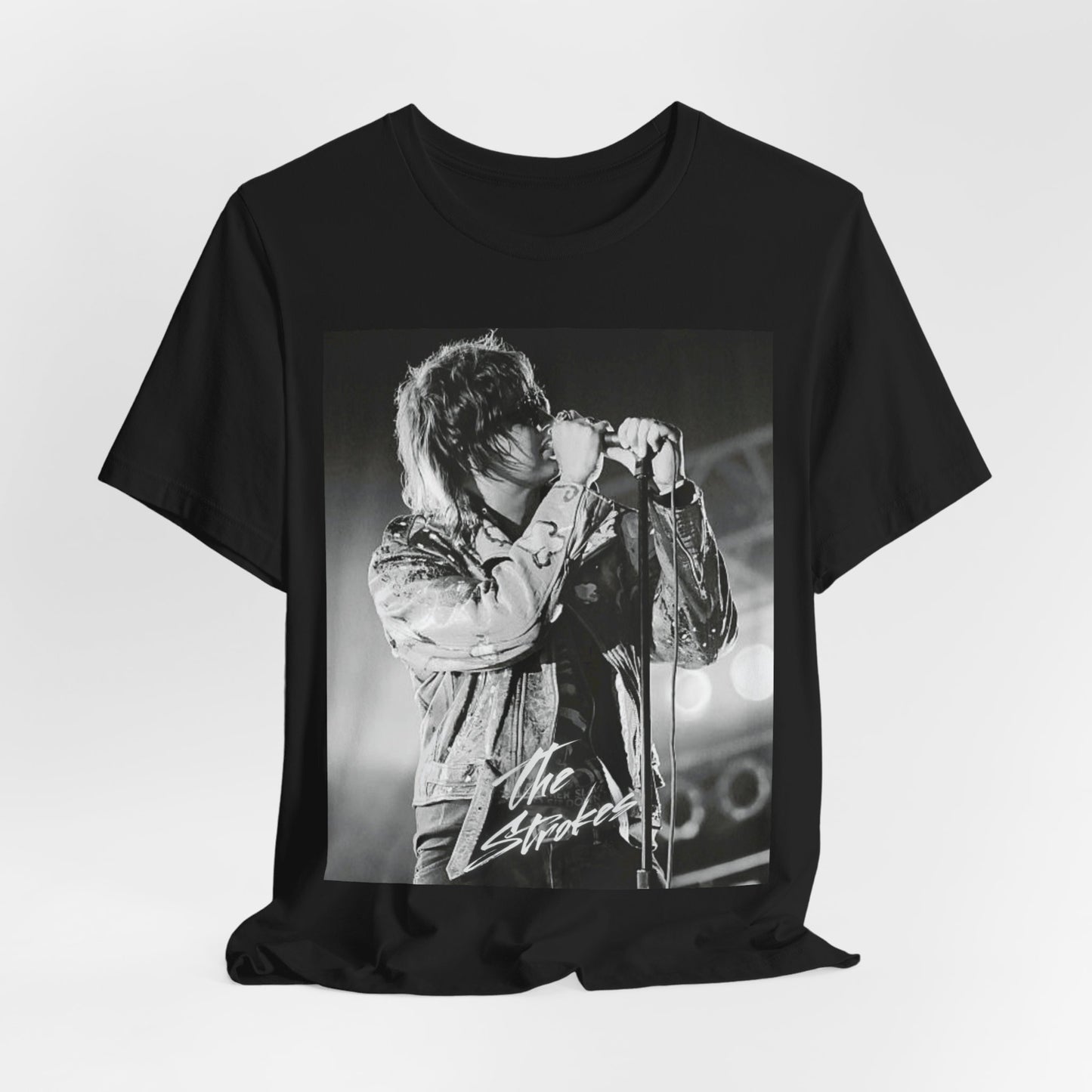 A black graphic t-shirt featuring a vintage graphic related to The Strokes' 'Last Nite' song or era.