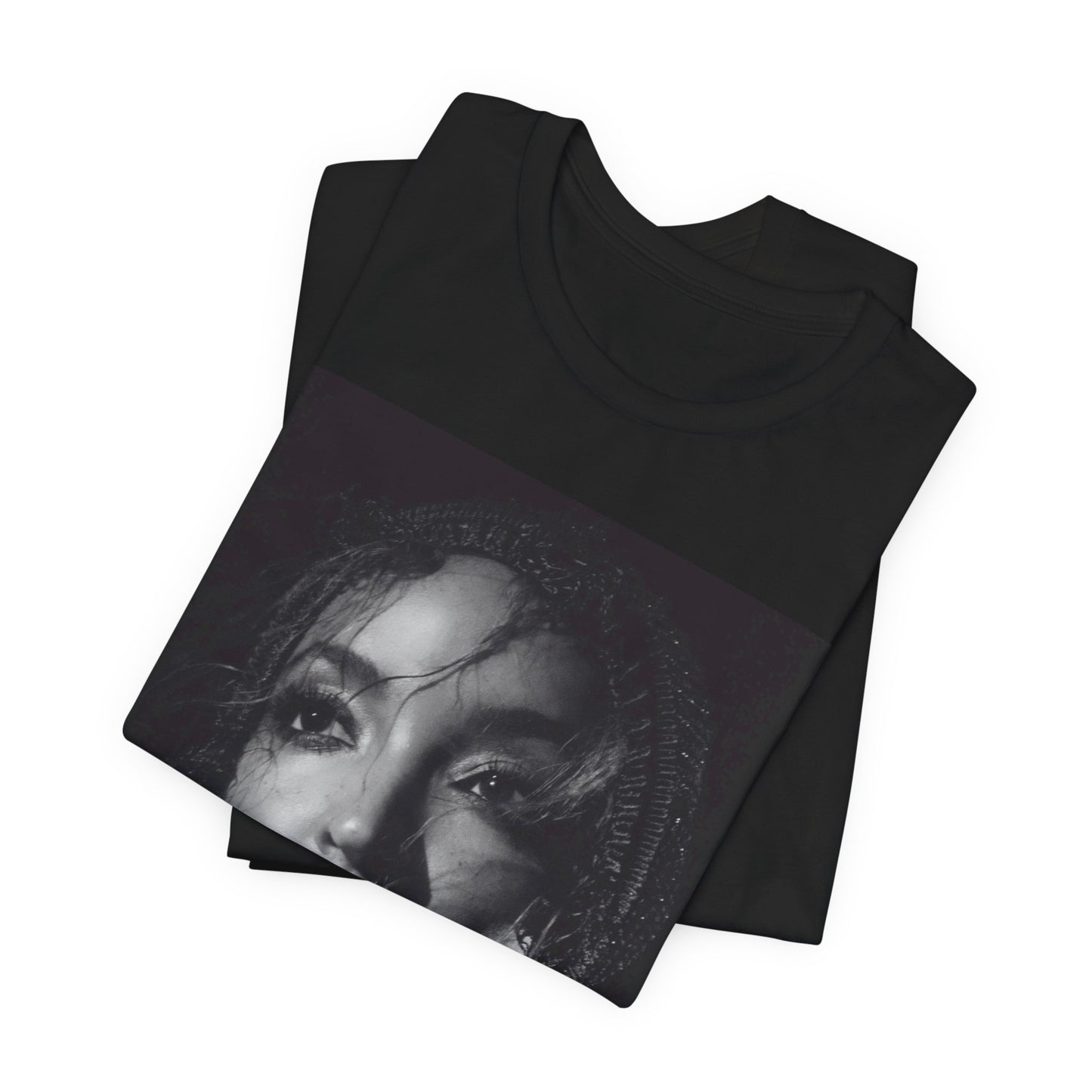 A black graphic t-shirt featuring a black and white portrait photo of Tinashe.