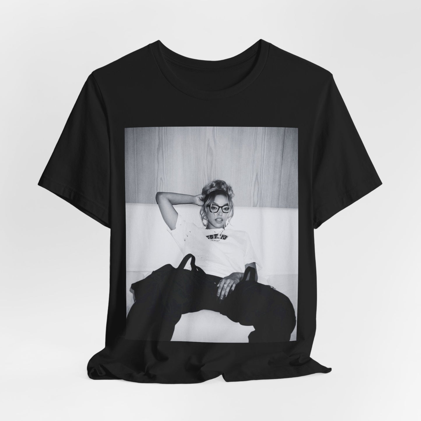 A black graphic t-shirt featuring a black and white portrait photo of Tinashe.