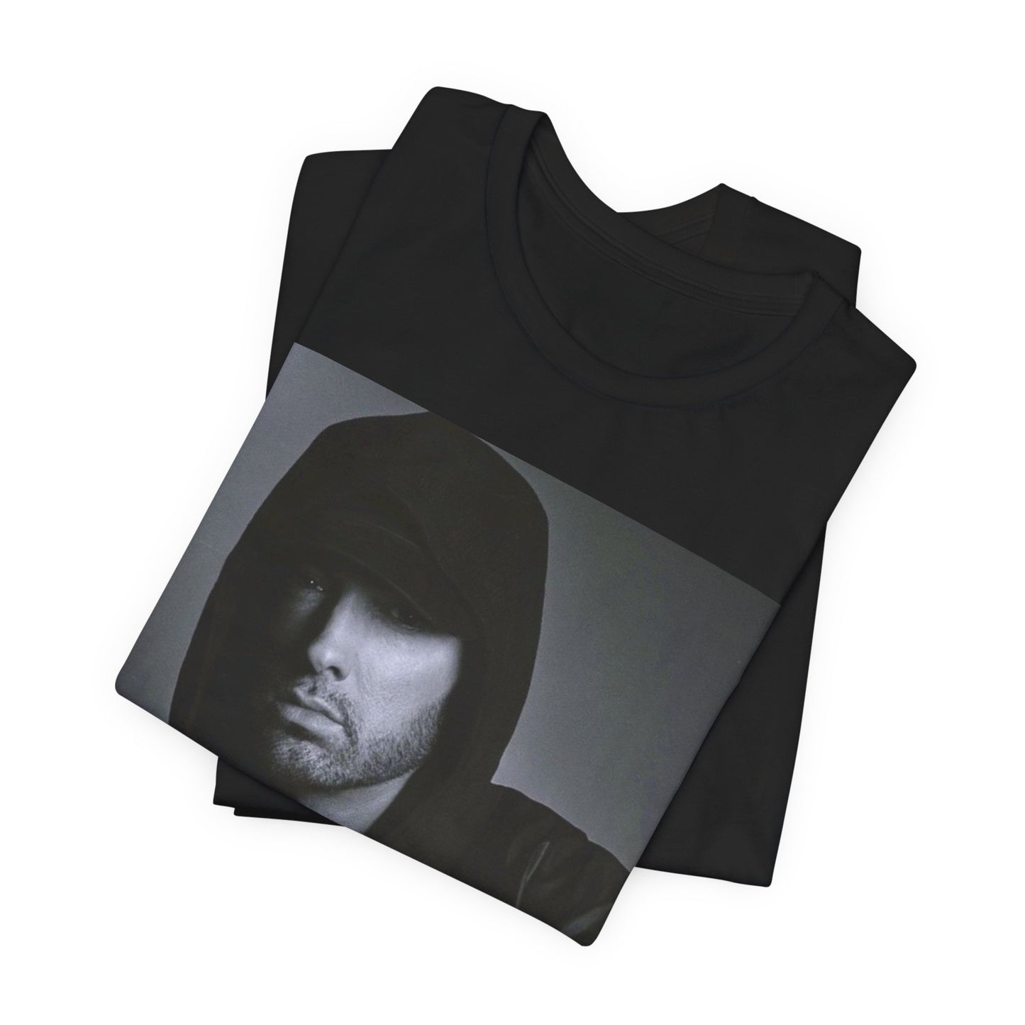 A black graphic t-shirt featuring a black and white, monochrome graphic or photo of Eminem.