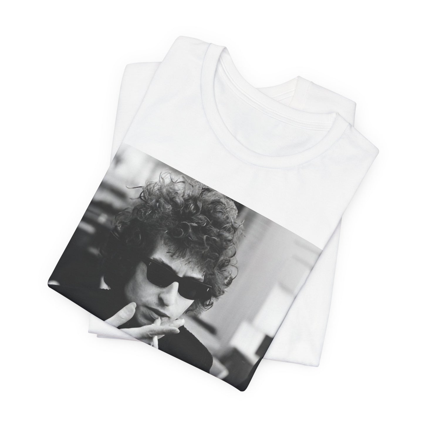 A black graphic t-shirt featuring a retro black and white graphic of Bob Dylan in a rebellious pose.