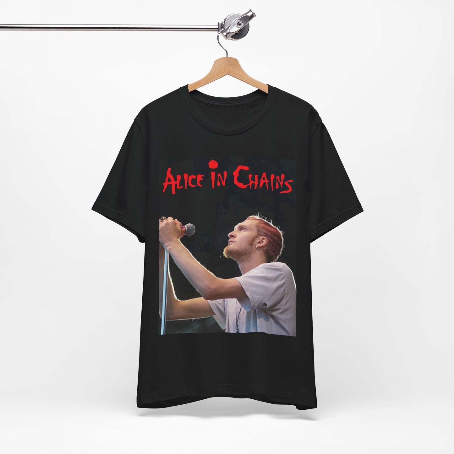 A black graphic t-shirt featuring the Alice In Chains logo in red, in a 90s grunge style.