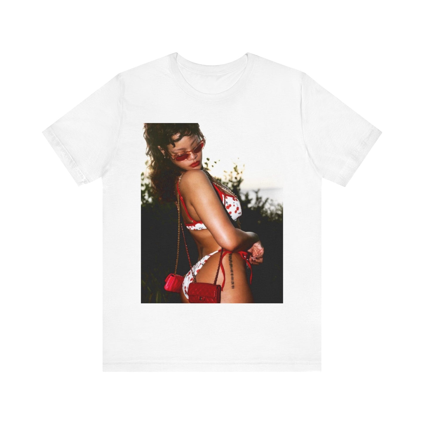 A black graphic t-shirt featuring a photo graphic of Rihanna in a bikini.