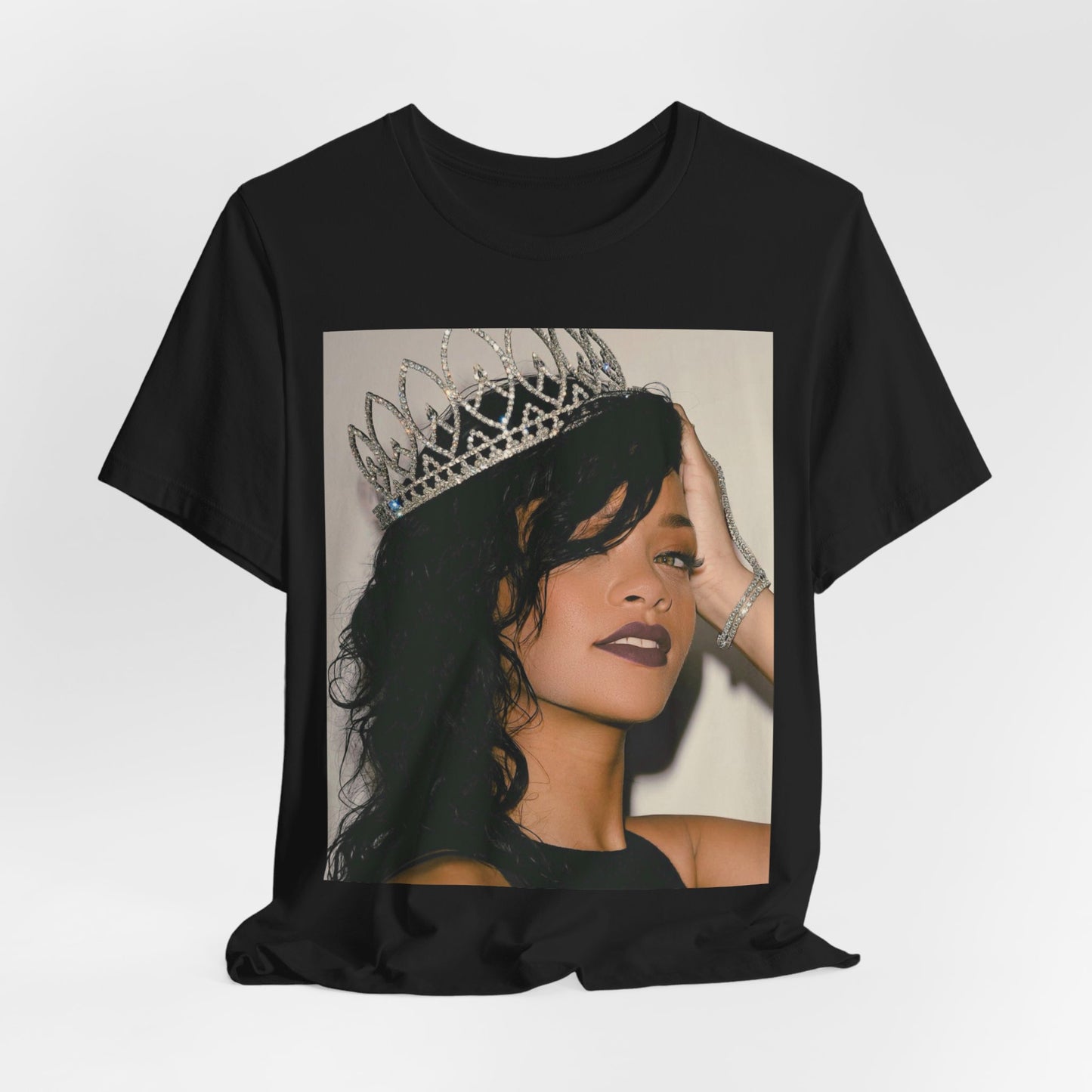 A black graphic t-shirt featuring a Y2K pop aesthetic graphic of Rihanna.